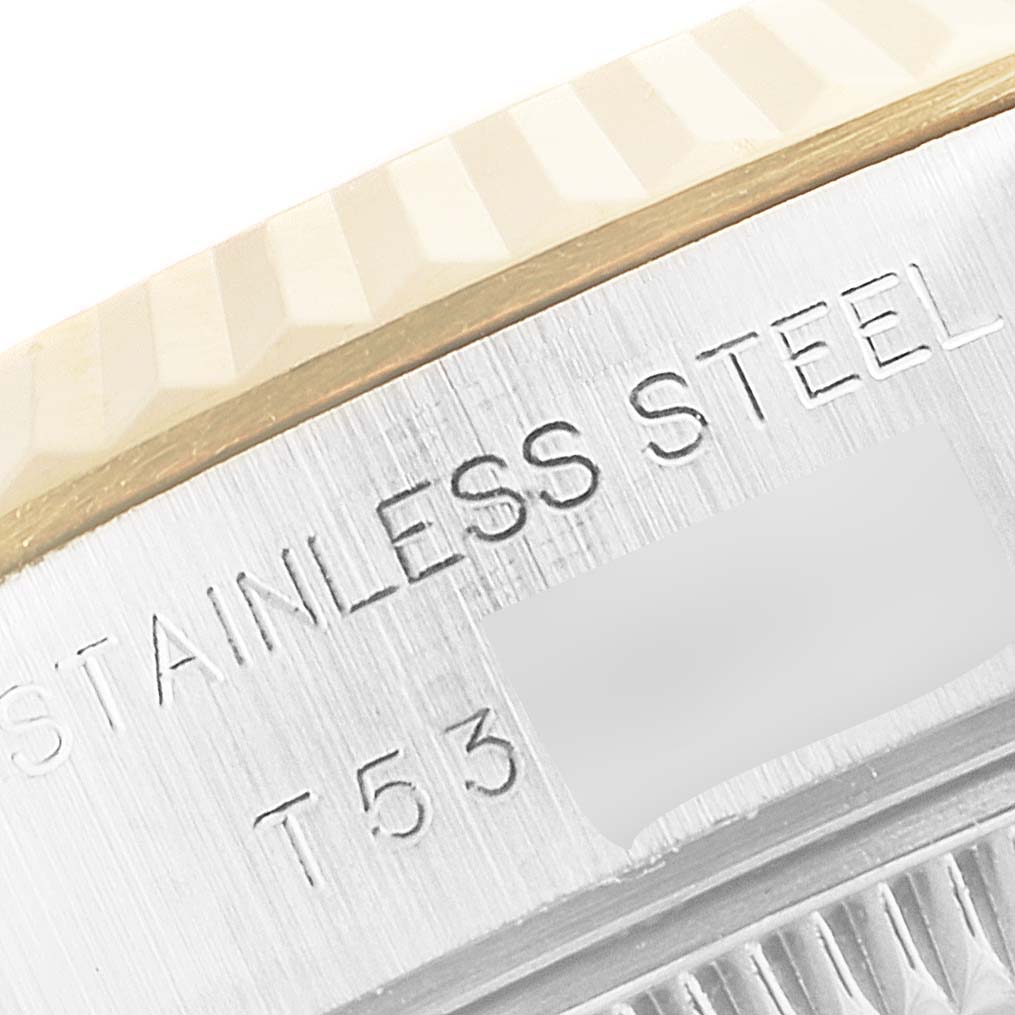 Close-up image of the engraved case back of a Rolex Datejust 69173 Women's Steel and Gold (two tone) White Dial 69173 Women's Steel and Gold (two tone) White Dial watch, showing "STAINLESS STEEL" and part of the serial number.