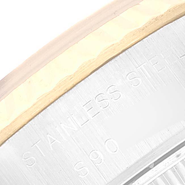 This is a close-up image of the case-back edge showing text of a Rolex Datejust 69173 Women's Steel and Gold (two tone) Beige Dial 69173 Women's Steel and Gold (two tone) Beige Dial watch.