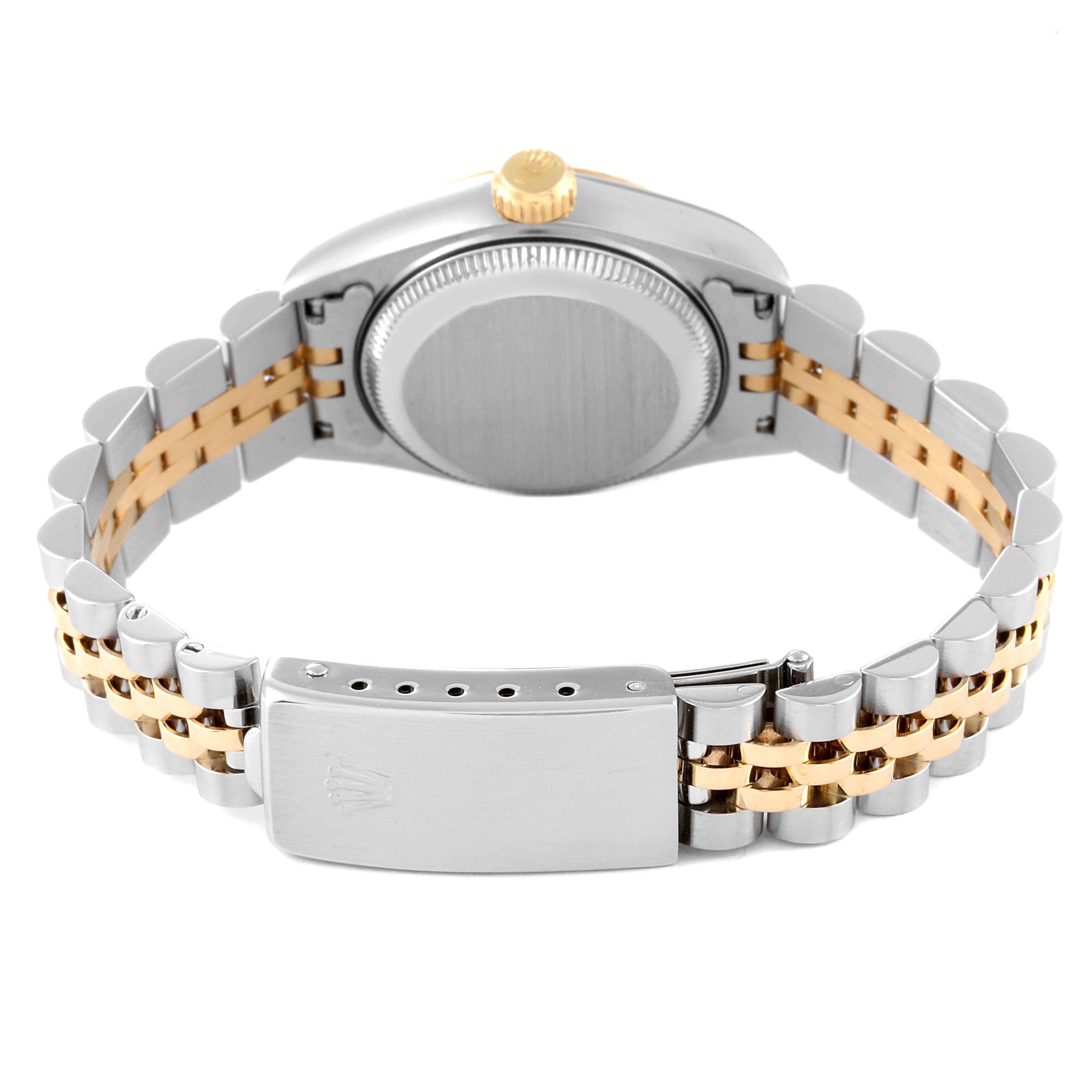 The image shows the back view of a Rolex Datejust 69173 Women's Steel and Gold (two tone) Beige Dial 69173 Women's Steel and Gold (two tone) Beige Dial watch, highlighting its metal case, crown, and two-tone metal bracelet.