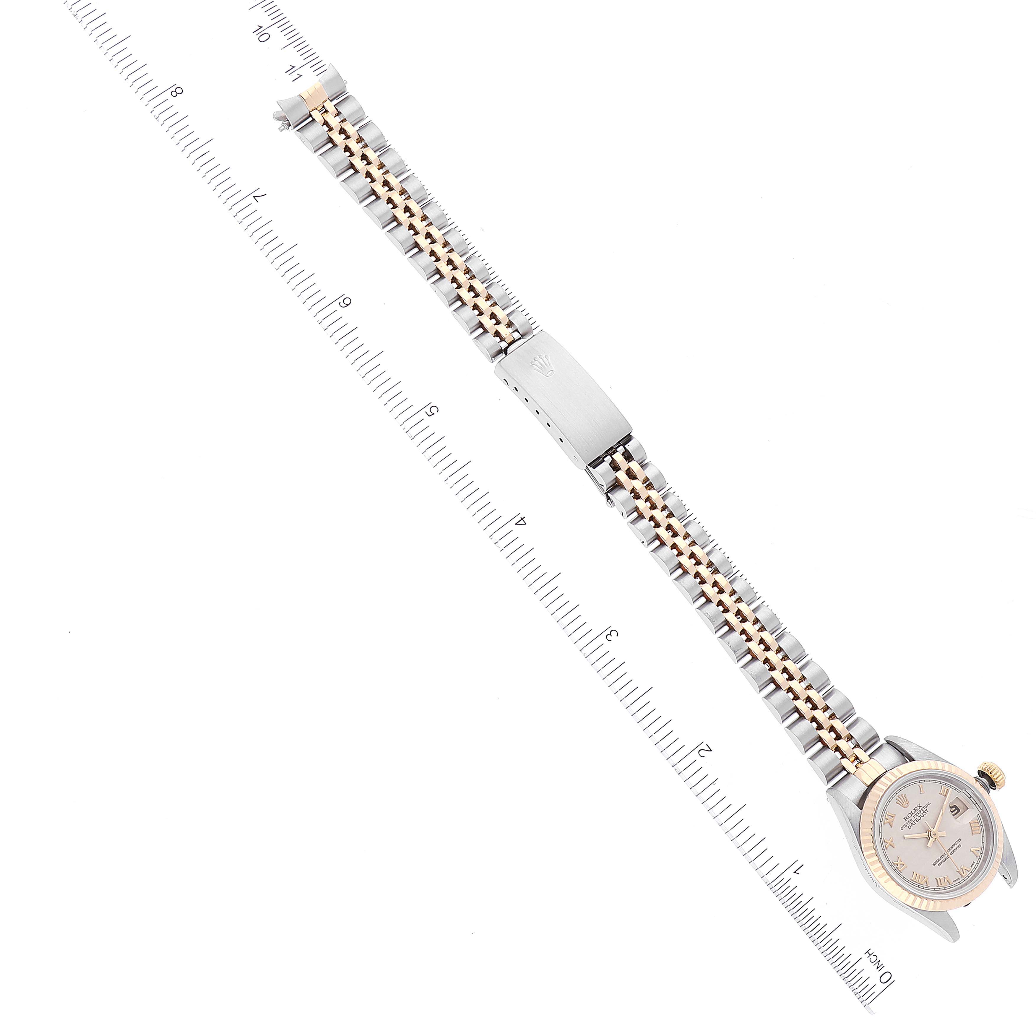 The image shows a Rolex Datejust 69173 Women's Steel and Gold (two tone) Beige Dial 69173 Women's Steel and Gold (two tone) Beige Dial watch laid flat, with the face and metal bracelet fully visible, alongside a ruler for scale.