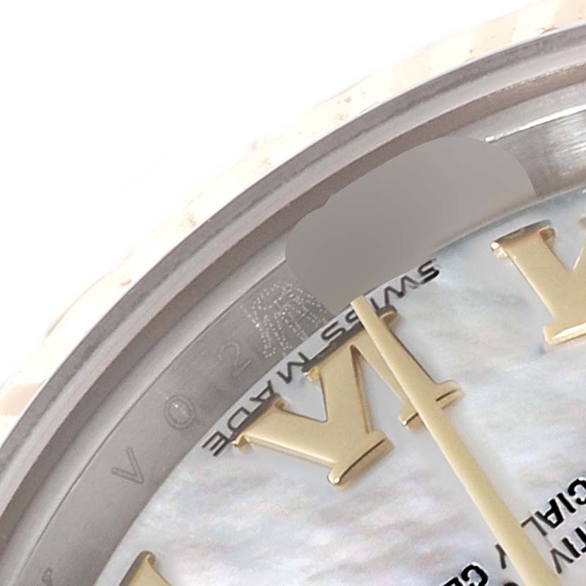 The image shows a close-up of the dial and part of the bezel of the Rolex Datejust 179173 Women's Steel and Gold (two tone) Mother of Pearl Dial 179173 Women's Steel and Gold (two tone) Mother of Pearl Dial watch, displaying Roman numerals and "SWISS MADE."