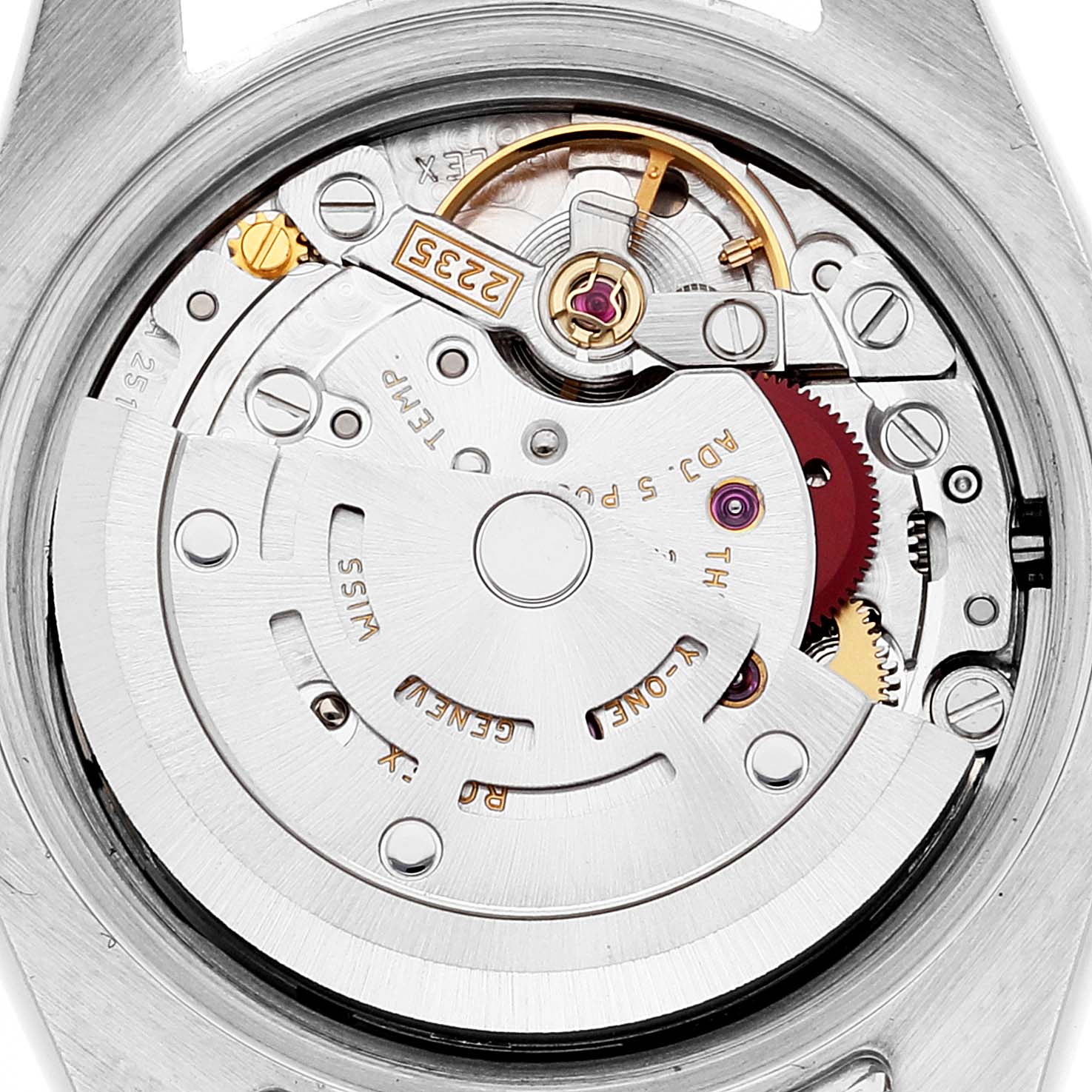 The image shows the intricate internal mechanism of a Rolex Datejust 179173 Women's Steel and Gold (two tone) Mother of Pearl Dial 179173 Women's Steel and Gold (two tone) Mother of Pearl Dial watch, specifically the movement and rotor, viewed from the back.