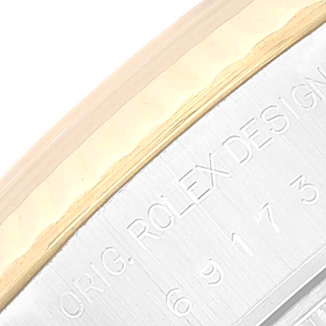 This image shows a close-up of the side engraving on the case of a Rolex Datejust 69173 Women's Steel and Gold (two tone) Mother of Pearl Dial 69173 Women's Steel and Gold (two tone) Mother of Pearl Dial watch, highlighting the brand inscription.