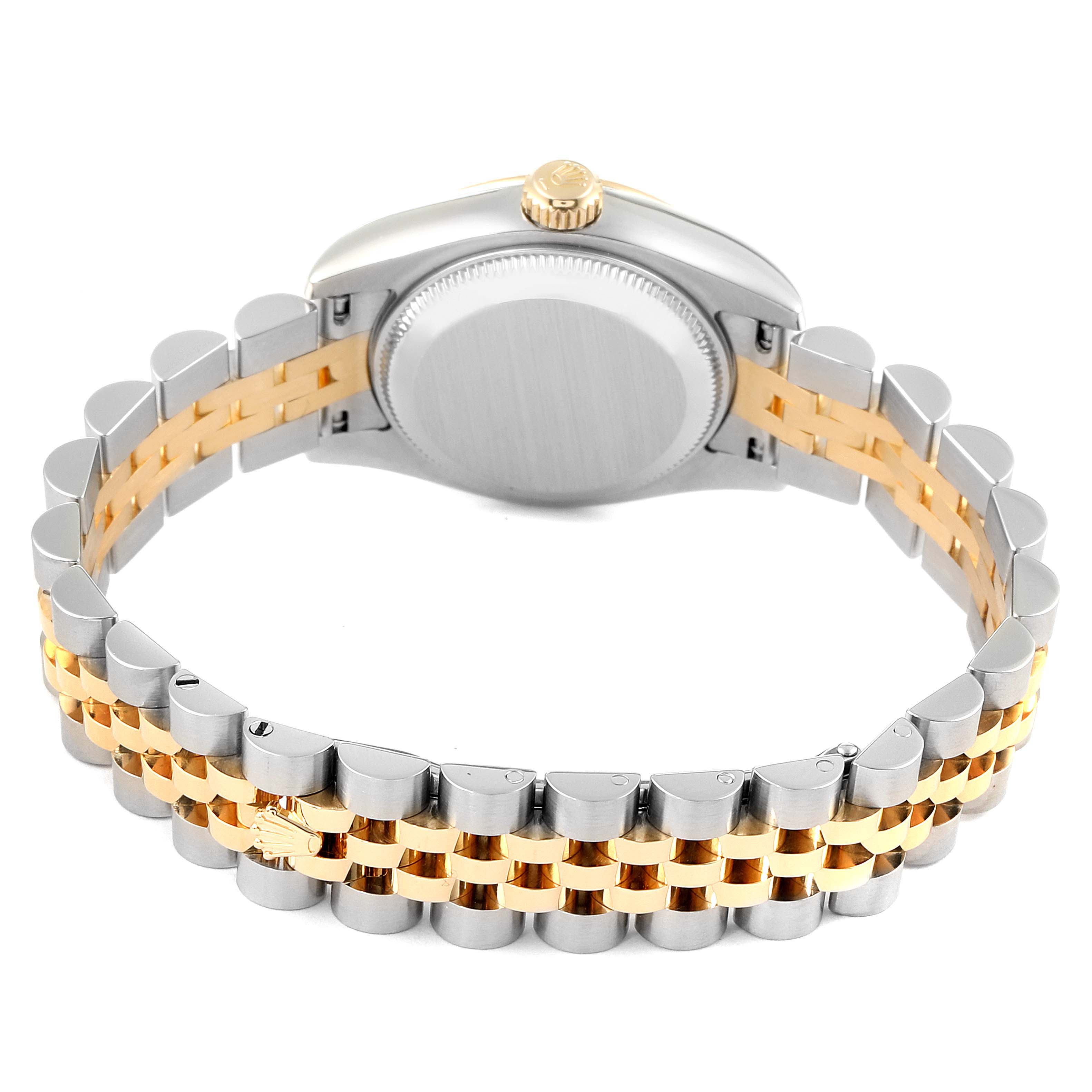 The image shows the back view of a Rolex Datejust 179173 Women
s Steel and Gold (two tone) Mother of Pearl Dial 179173 Women
s Steel and Gold (two tone) Mother of Pearl Dial watch, focusing on the case back, crown, and two-tone Jubilee bracelet.