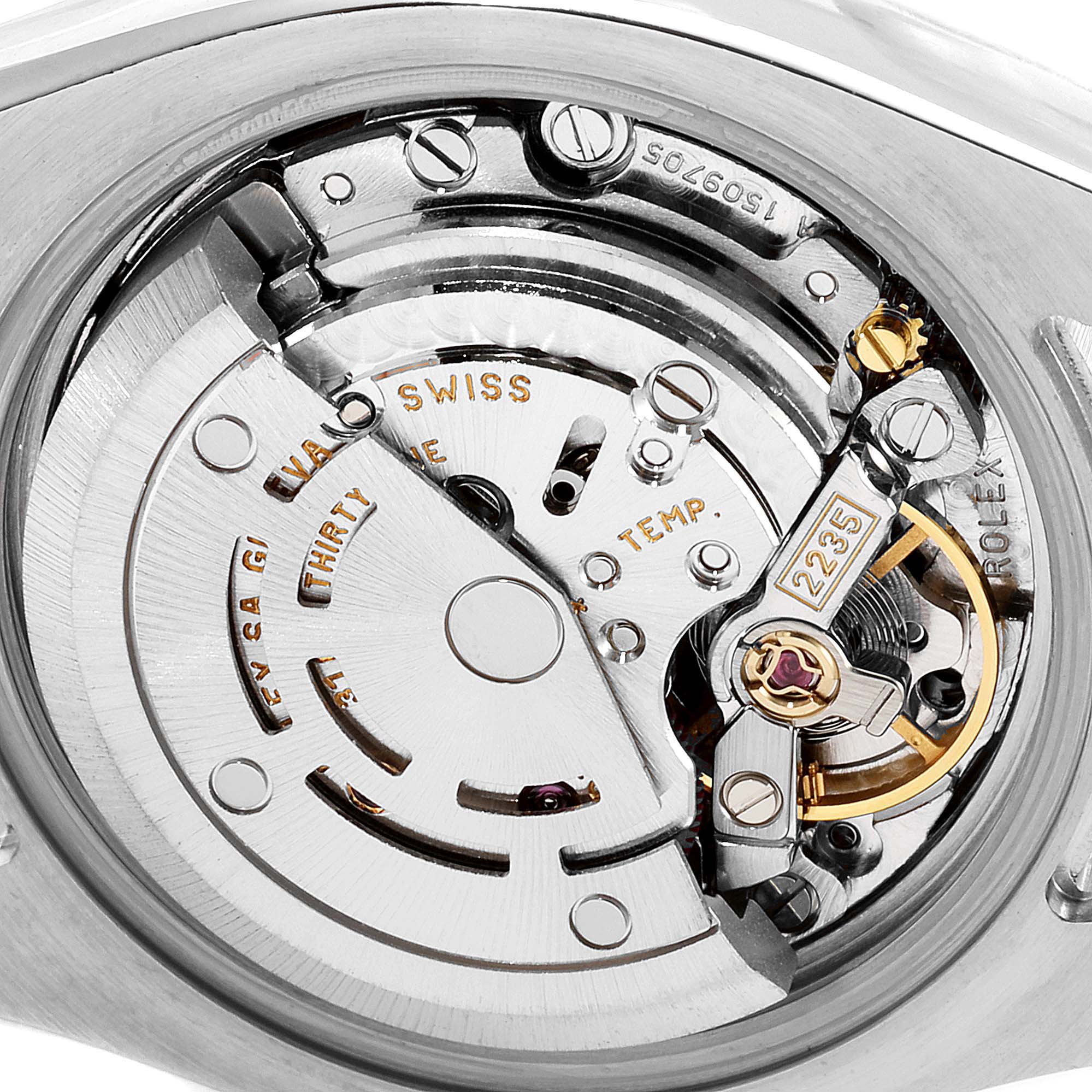 The image shows the inner mechanical movement of the Rolex Datejust 179173 Women
s Steel and Gold (two tone) Mother of Pearl Dial 179173 Women
s Steel and Gold (two tone) Mother of Pearl Dial watch from a close-up angle, highlighting its intricate components.