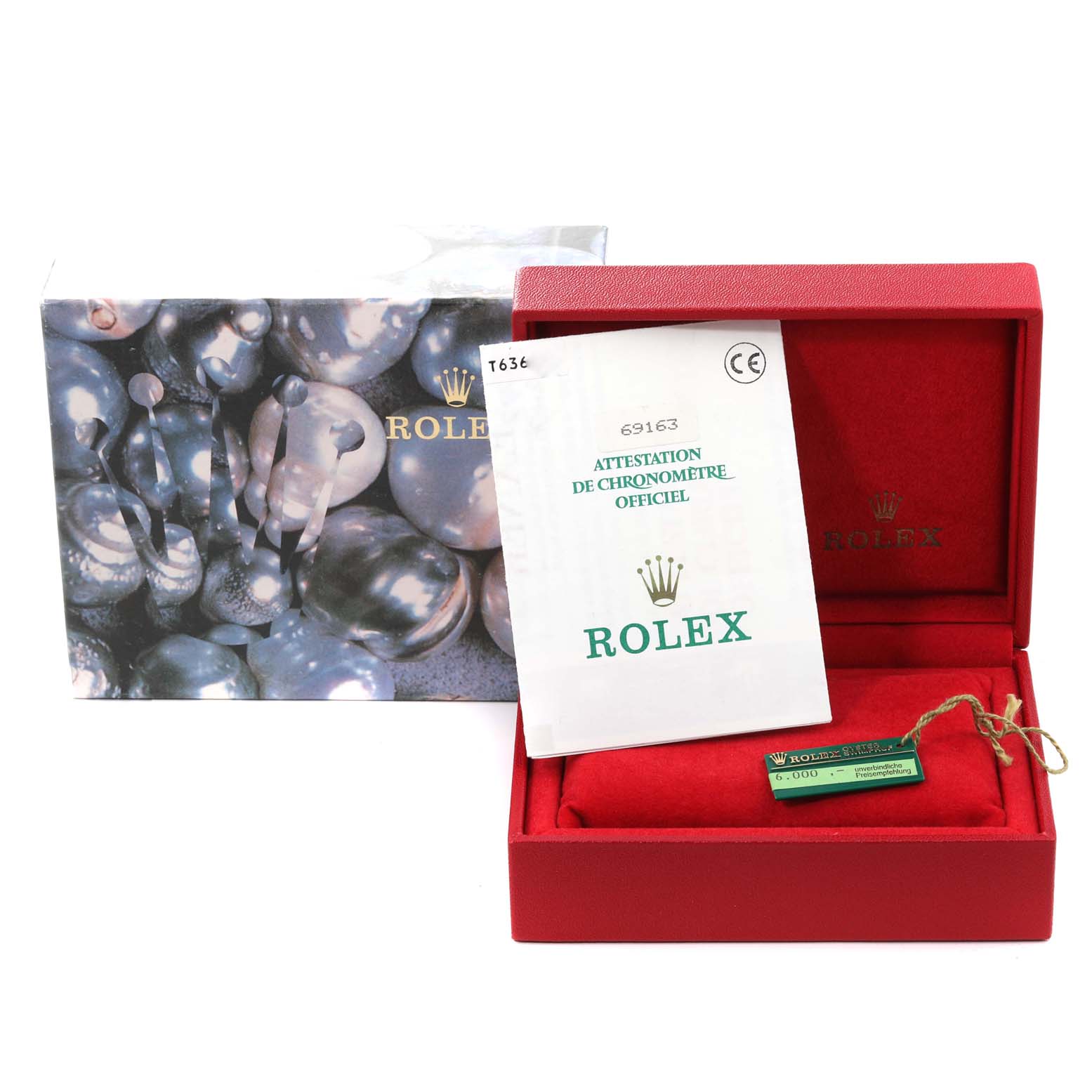 The image shows the packaging and accessories for a Rolex Datejust 69163 Women's Steel and Gold (two tone) White Dial 69163 Women's Steel and Gold (two tone) White Dial, including a box, certificate, and hang tag.