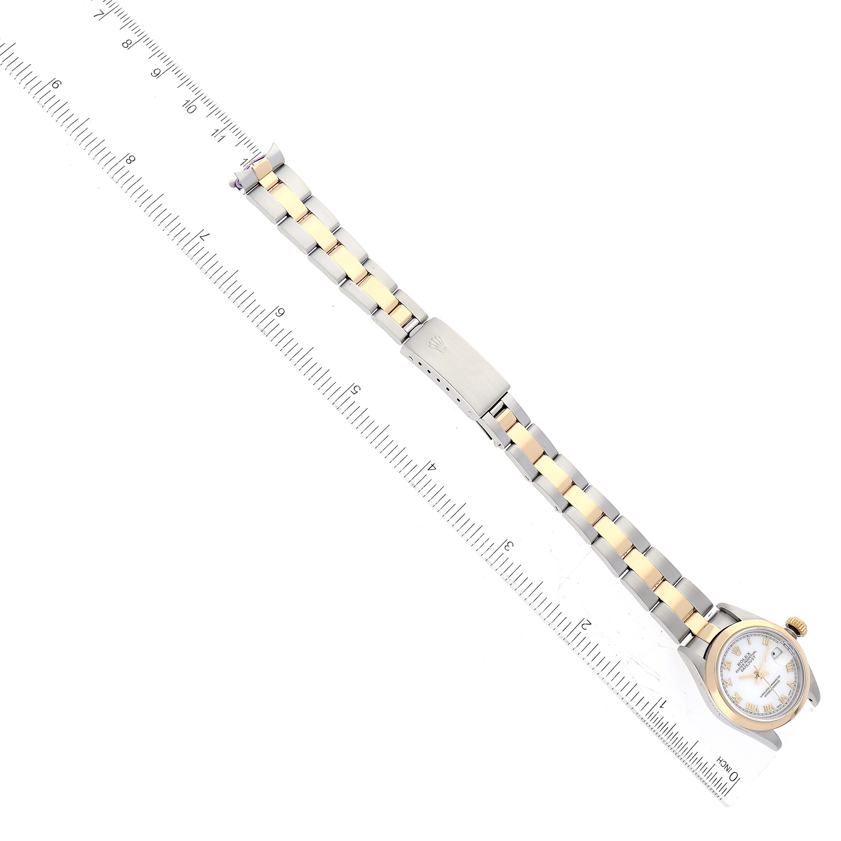 The image shows a full view of a Rolex Datejust 69163 Women's Steel and Gold (two tone) White Dial 69163 Women's Steel and Gold (two tone) White Dial watch, including the face, bracelet, and clasp, laid next to a ruler.