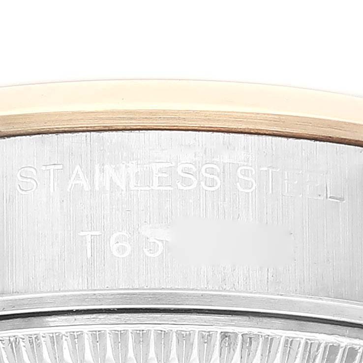 The image shows a close-up of the side of a Rolex Datejust 69163 Women's Steel and Gold (two tone) White Dial 69163 Women's Steel and Gold (two tone) White Dial watch, highlighting its stainless steel case and part of the model number.
