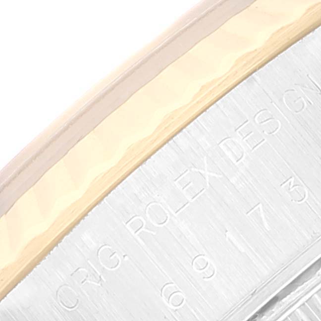 The image shows a close-up of the side of a Rolex Datejust 69173 Women's Steel and Gold (two tone) White Dial 69173 Women's Steel and Gold (two tone) White Dial watch, highlighting the engraved text and part of the bezel.