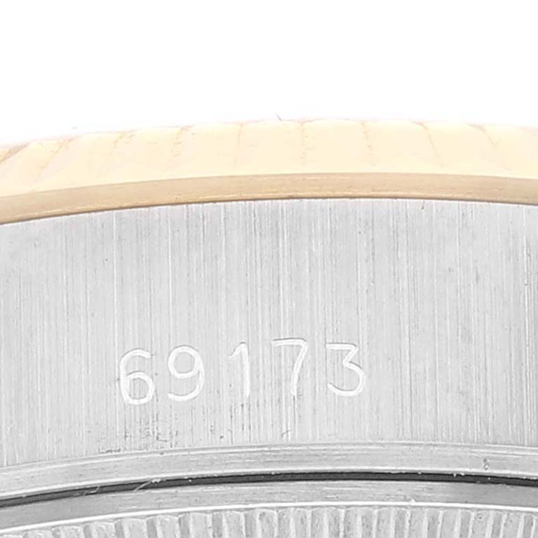 This image shows a close-up of the serial number on the case side of a Rolex Datejust 69173 Women's Steel and Gold (two tone) White Dial 69173 Women's Steel and Gold (two tone) White Dial model.