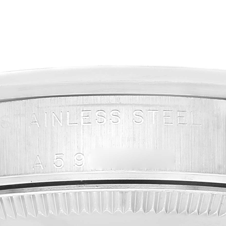 This close-up image shows the side engraving on the stainless steel case of a Mid-Size Rolex watch.