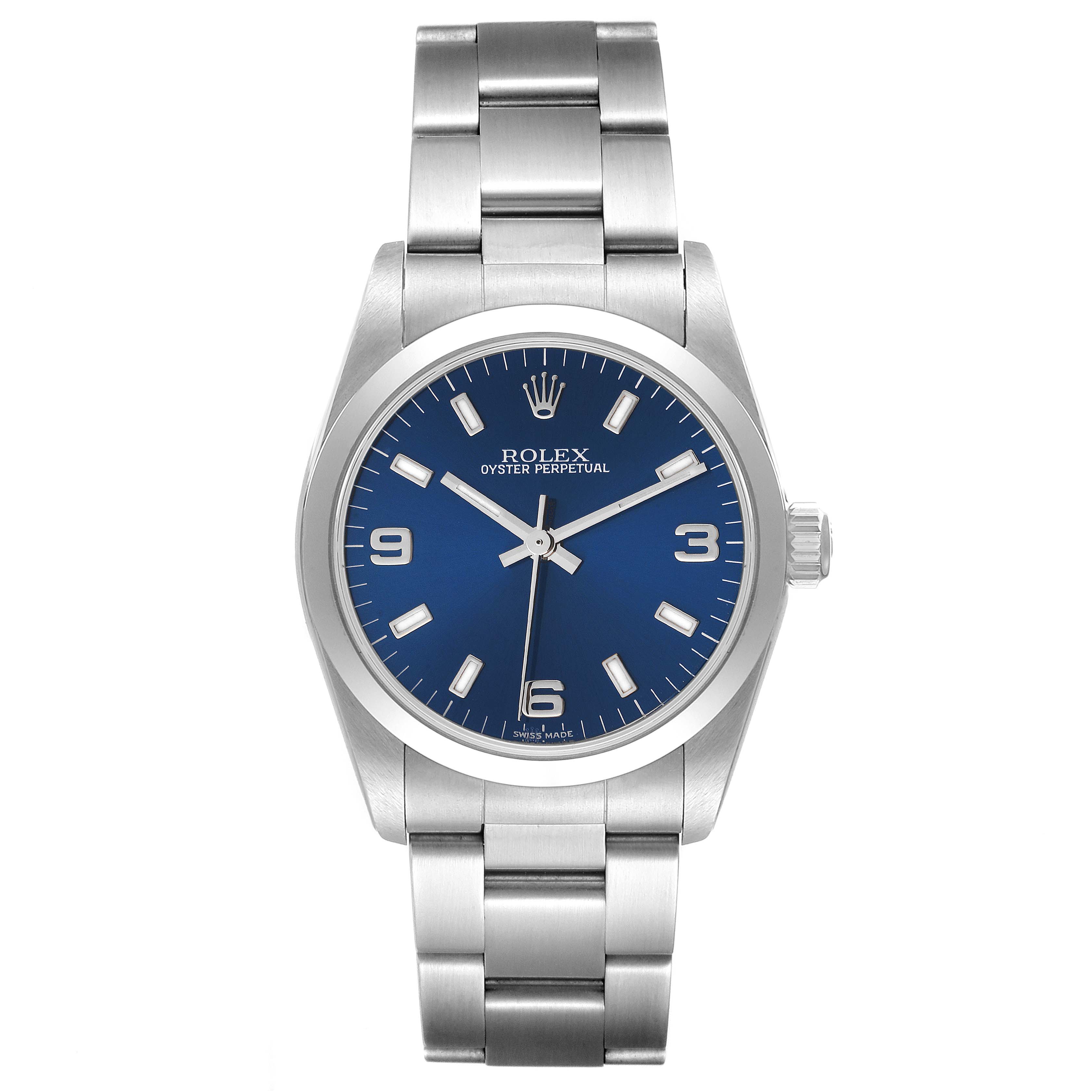 The Rolex Mid-Size 77080 Women
s Stainless Steel Blue Dial 77080 Women
s Stainless Steel Blue Dial Oyster Perpetual watch is captured from a front-facing angle showcasing its dial, bezel, and bracelet.