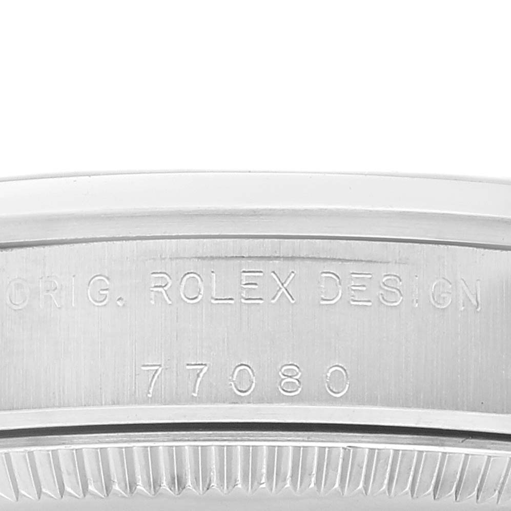 The image shows a close-up of the side of a Mid-Size Rolex watch displaying the engraved model number "77080."