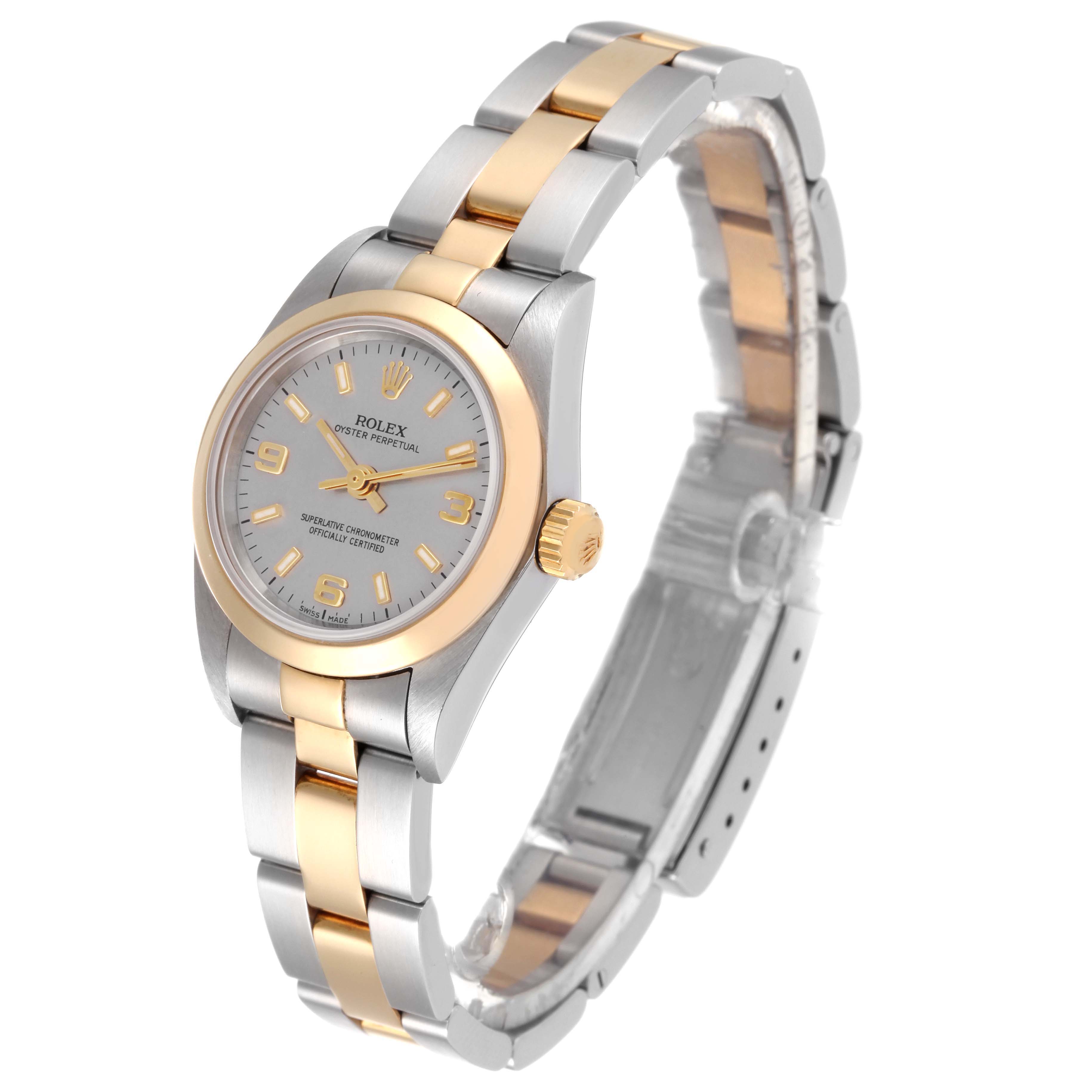 The Rolex Oyster Perpetual 76183 Women's Steel and Gold (two tone) Grey Dial 76183 Women's Steel and Gold (two tone) Grey Dial watch is shown at an angled side view, highlighting its two-tone bracelet and watch face.