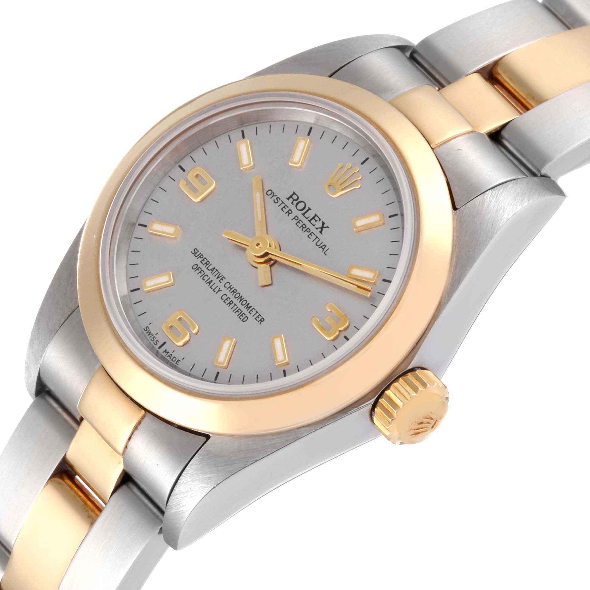 This image showcases a Rolex Oyster Perpetual 76183 Women's Steel and Gold (two tone) Grey Dial 76183 Women's Steel and Gold (two tone) Grey Dial watch, focusing on the dial, bezel, crown, and part of the bracelet from a slightly tilted side angle.
