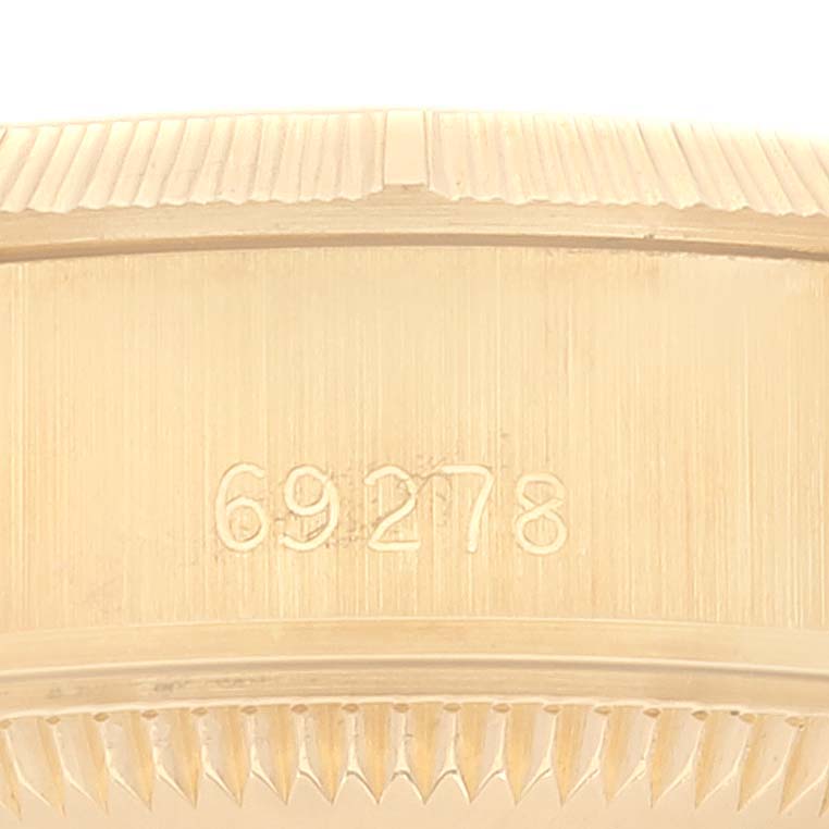 This image shows the side view of the bezel and case of the Rolex President 69278 Women's Yellow Gold Champagne Dial 69278 Women's Yellow Gold Champagne Dial model.