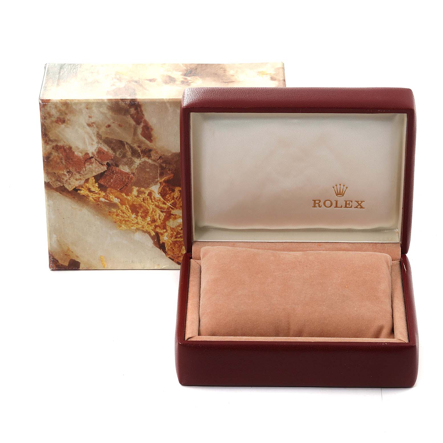 This image shows an open Rolex watch box and outer packaging for the President model, showcasing the interior cushion and branding.