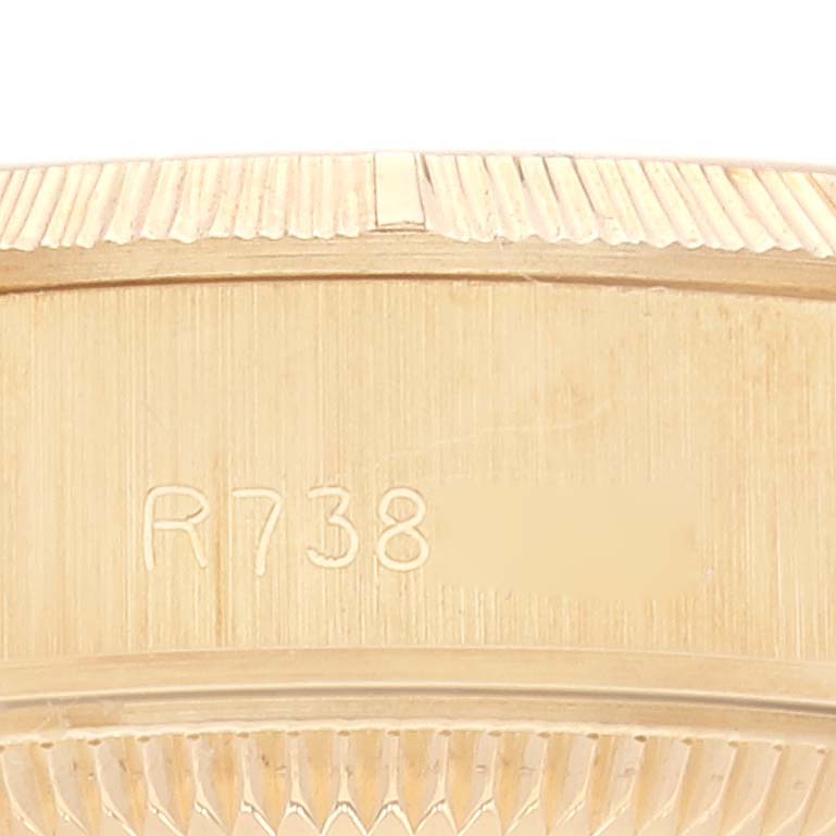 This image shows the side view of the bezel of a Rolex President 69278 Women's Yellow Gold Champagne Dial 69278 Women's Yellow Gold Champagne Dial model watch, highlighting the fluted design and reference number.
