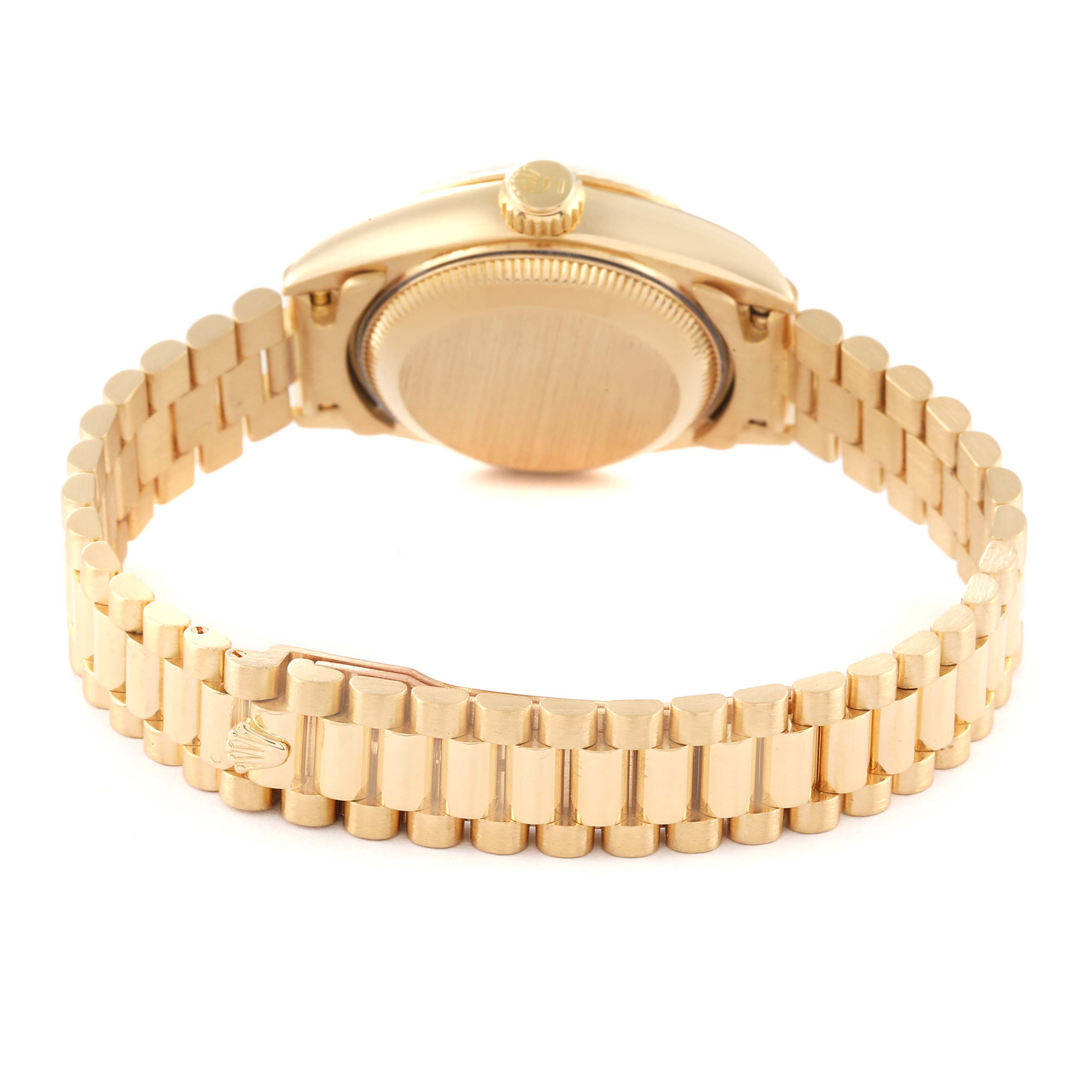 This image shows the backside of a Rolex President 69178 Women's Yellow Gold Champagne Dial 69178 Women's Yellow Gold Champagne Dial watch, highlighting the case back, crown, and bracelet.