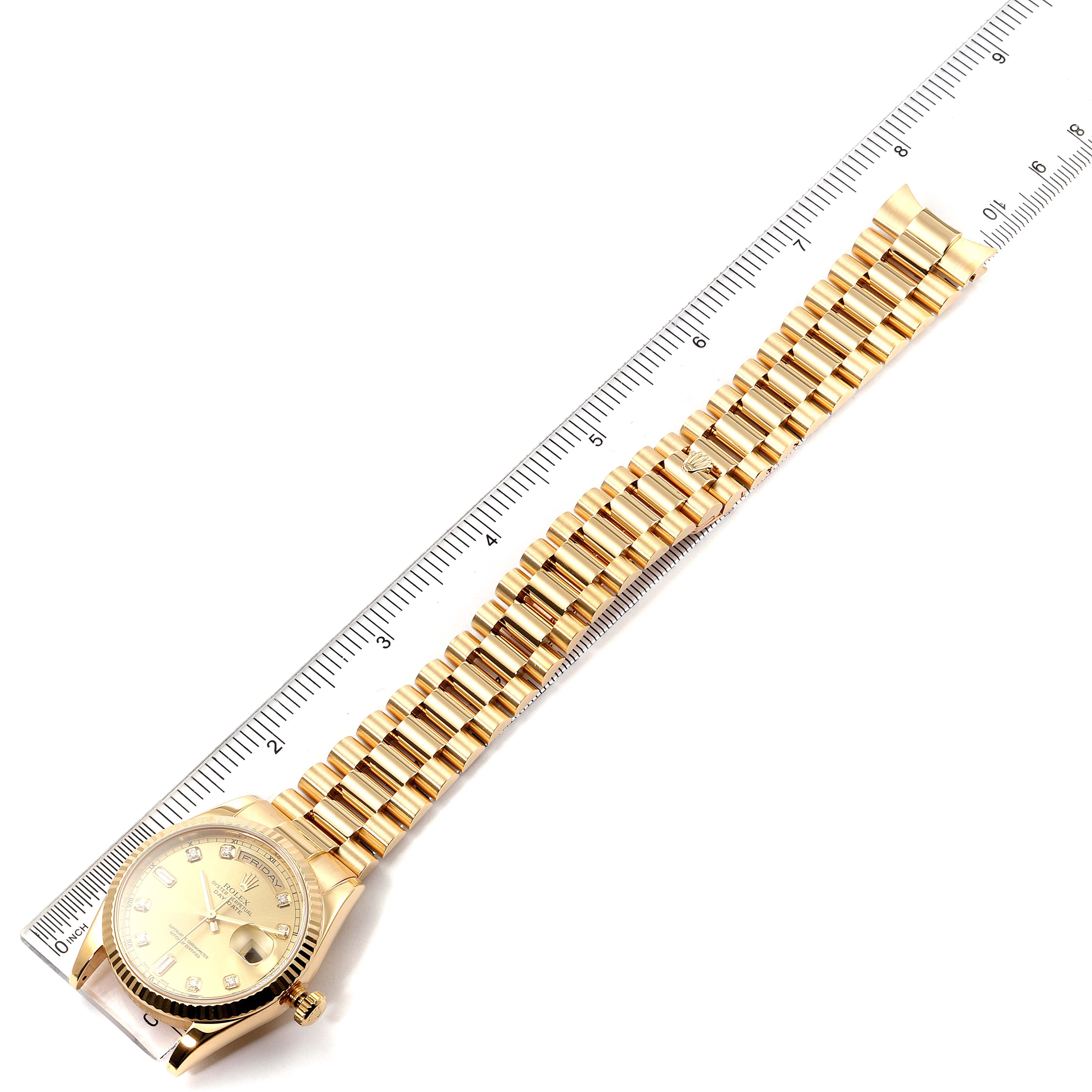 The image shows a Rolex President 118238 Men
s Yellow Gold Champagne Dial 118238 Men
s Yellow Gold Champagne Dial watch laid flat with its face, bezel, and bracelet visible, measured alongside a ruler.