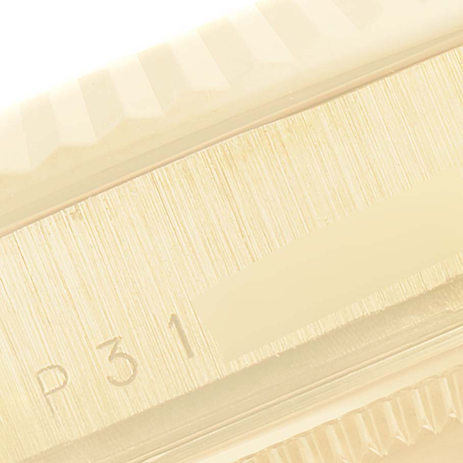 This close-up image shows the bezel and part of the case of a Rolex President 118238 Men
s Yellow Gold Champagne Dial 118238 Men
s Yellow Gold Champagne Dial model.