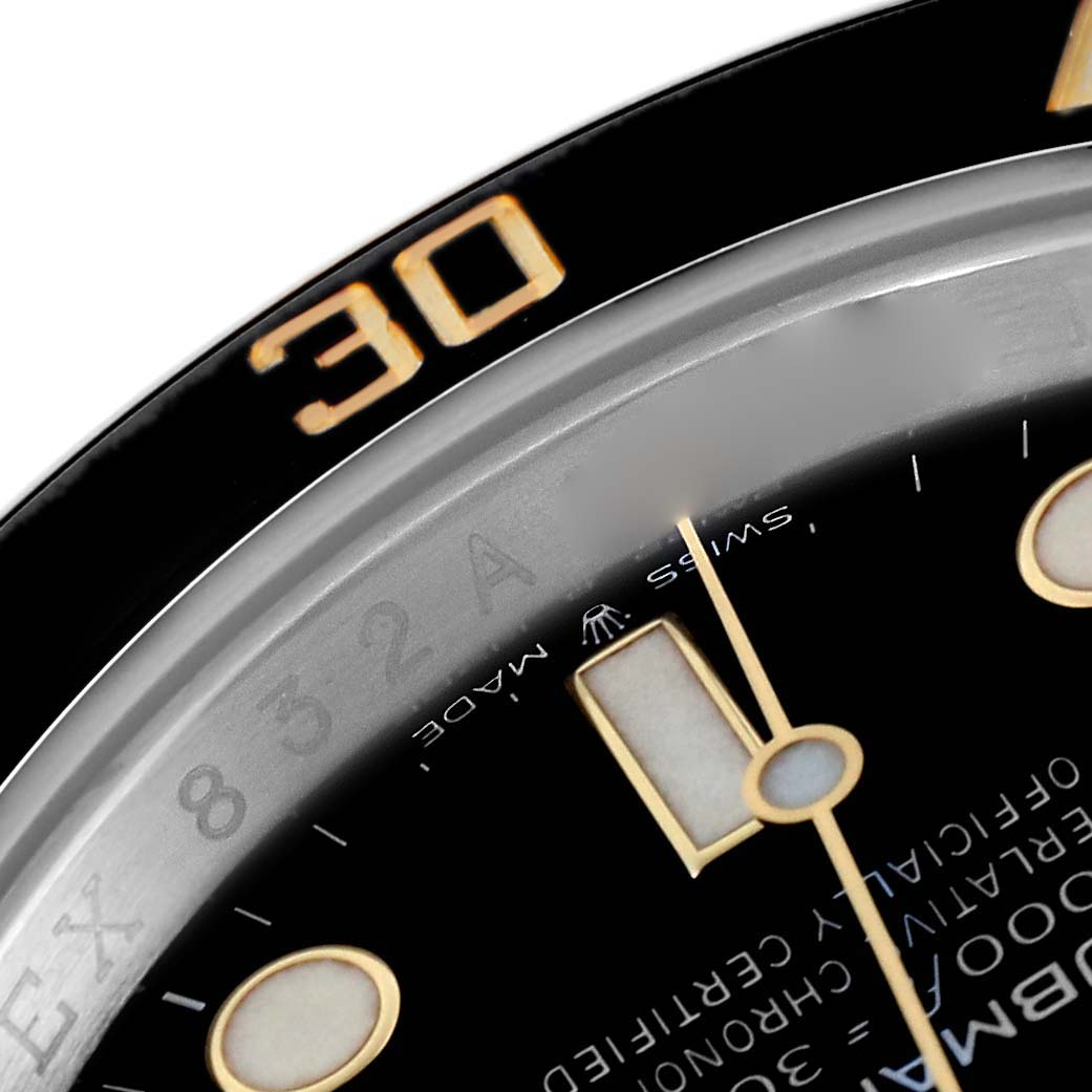 The image shows a close-up of the Rolex Submariner 126613LN Men's Steel and Gold (two tone) Black Dial 126613LN Men's Steel and Gold (two tone) Black Dial's dial and bezel, focusing on the 30-minute mark and luminous hour marker.