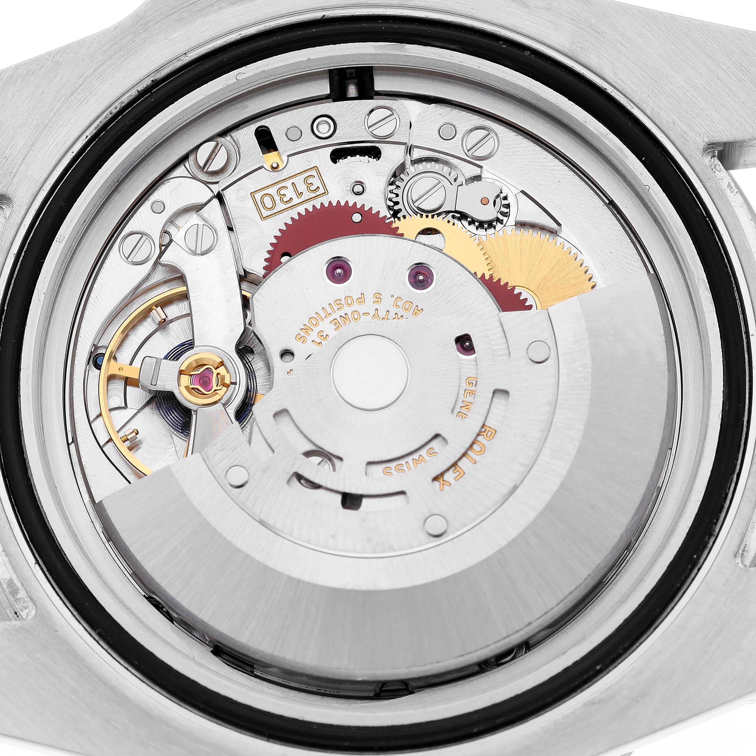 The image shows the internal mechanical movement of a Rolex Submariner 114060 Men's Stainless Steel Black Dial 114060 Men's Stainless Steel Black Dial watch from a rear angle, showcasing its intricate gears.