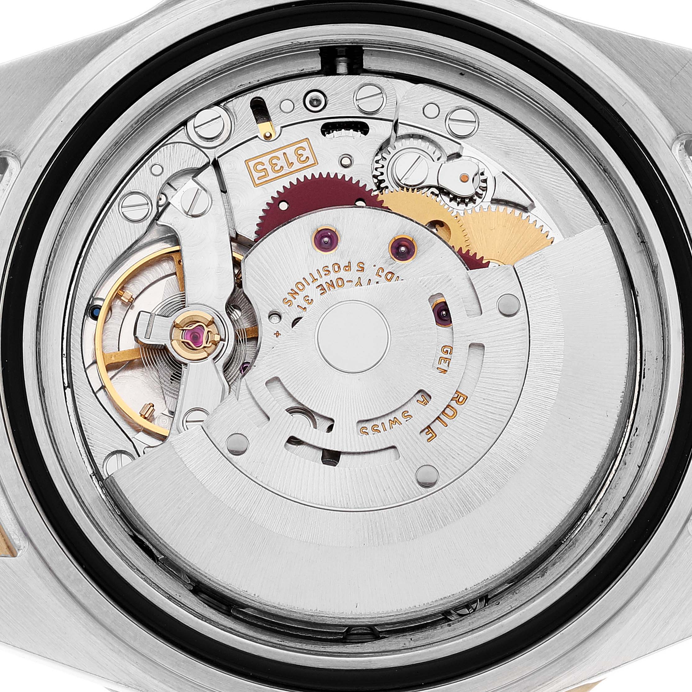 The image shows the internal mechanism of a Rolex Submariner 16613 Men's Steel and Gold (two tone) Blue Dial 16613 Men's Steel and Gold (two tone) Blue Dial watch from a top-down angle.