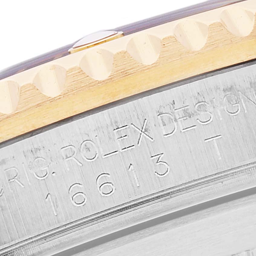 The image shows a close-up angle of the watch bezel and case side of a Rolex Submariner 16613 Men's Steel and Gold (two tone) Blue Dial 16613 Men's Steel and Gold (two tone) Blue Dial, revealing the model number engraving.