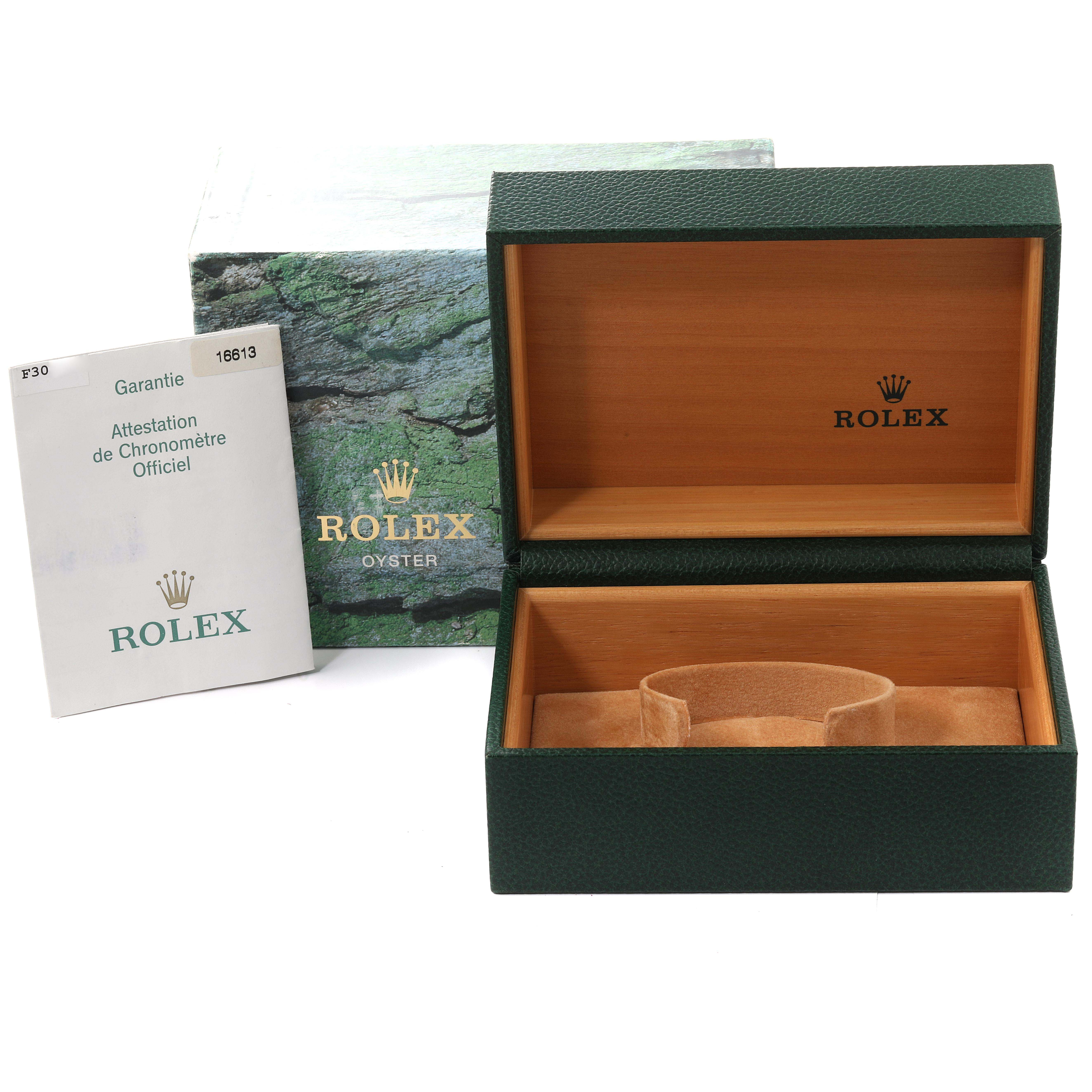 The image shows an open Rolex Submariner 16613 Men's Steel and Gold (two tone) Blue Dial 16613 Men's Steel and Gold (two tone) Blue Dial watch box with a guarantee card and an outer box visible.