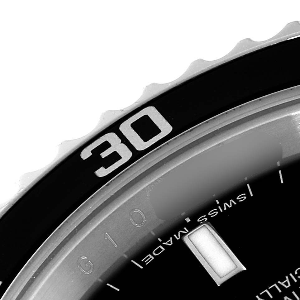 This close-up image shows the bezel and part of the dial of a Rolex Submariner 14060M Men
s Stainless Steel Black Dial 14060M Men
s Stainless Steel Black Dial watch.