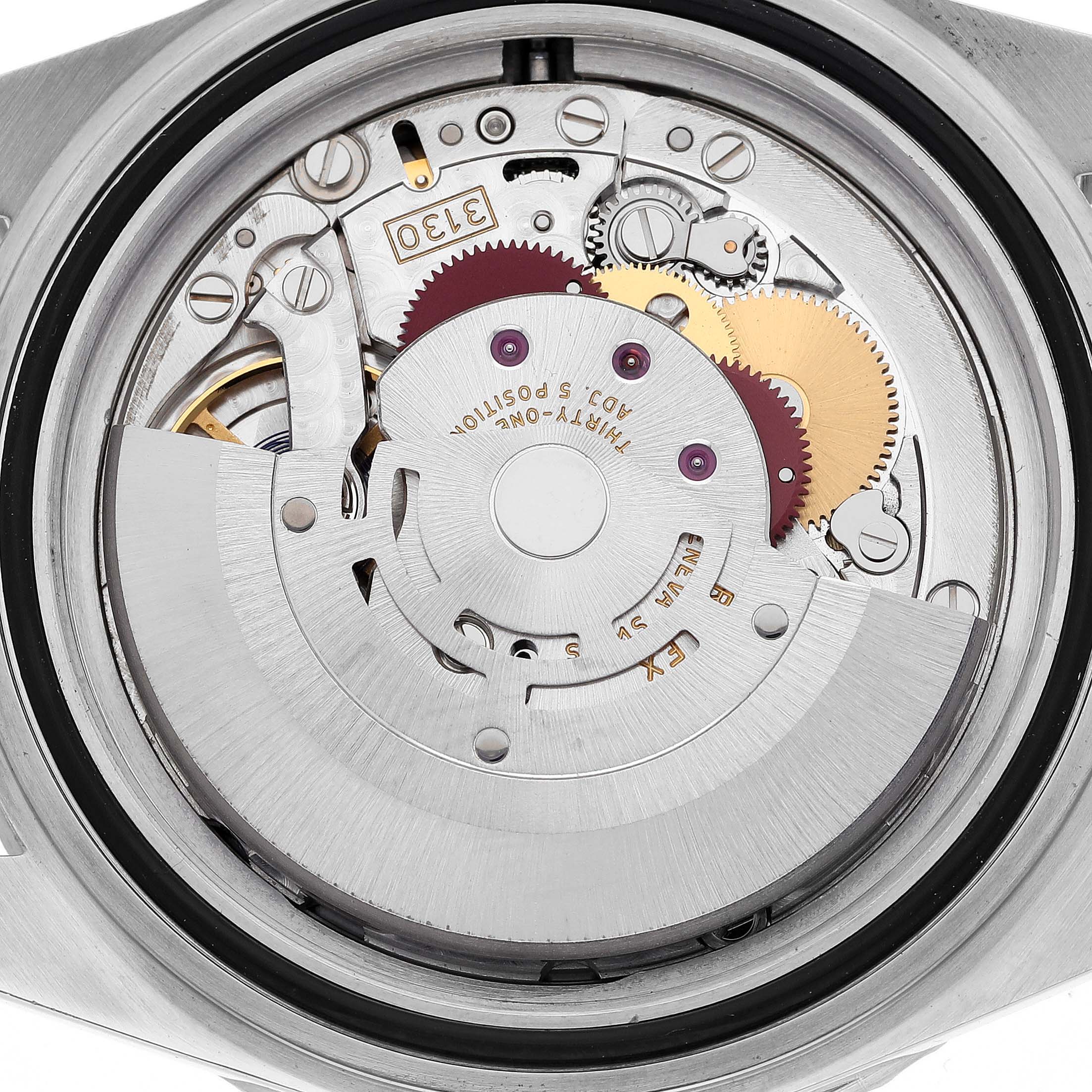 The image shows the internal movement mechanism of a Rolex Submariner 14060M Men
s Stainless Steel Black Dial 14060M Men
s Stainless Steel Black Dial watch from a back angle.