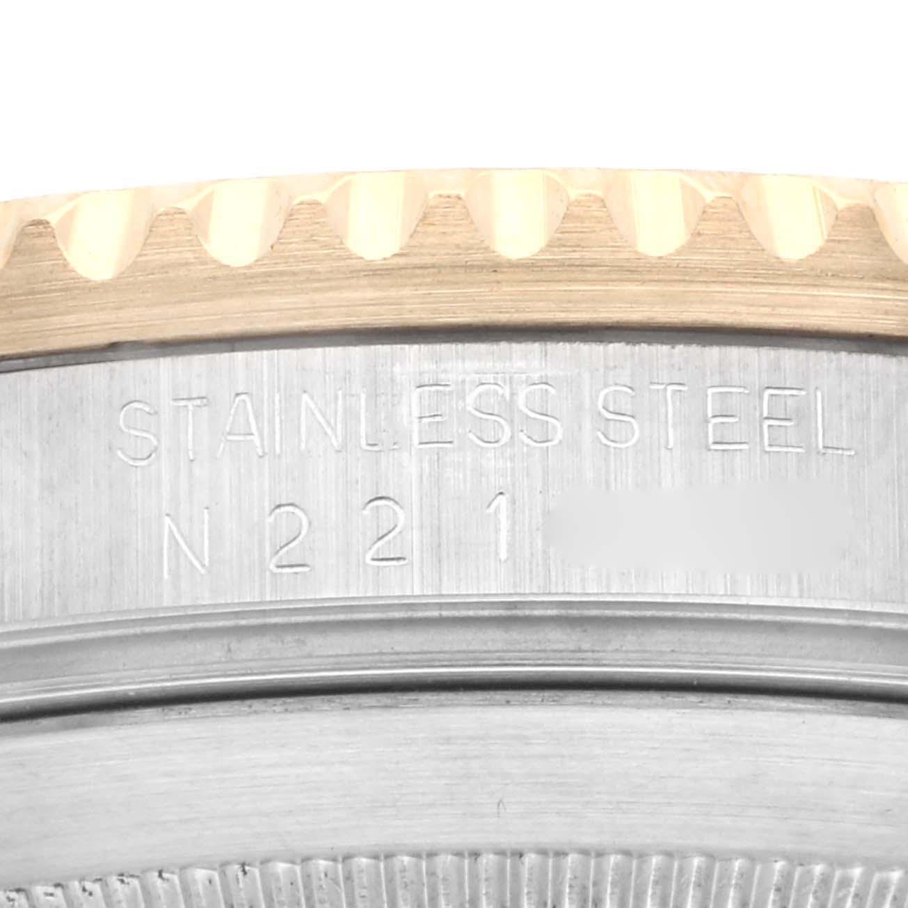 The image shows a close-up of the stainless steel case and bezel edge of a Rolex Submariner 16613 Men's Steel and Gold (two tone) Black Dial 16613 Men's Steel and Gold (two tone) Black Dial watch.