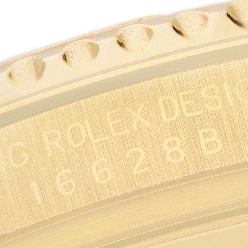 The image shows a close-up of the engraved edge and bezel of a Rolex Yacht-Master 16628 Men's Yellow Gold Mother of Pearl Dial 16628 Men's Yellow Gold Mother of Pearl Dial watch.