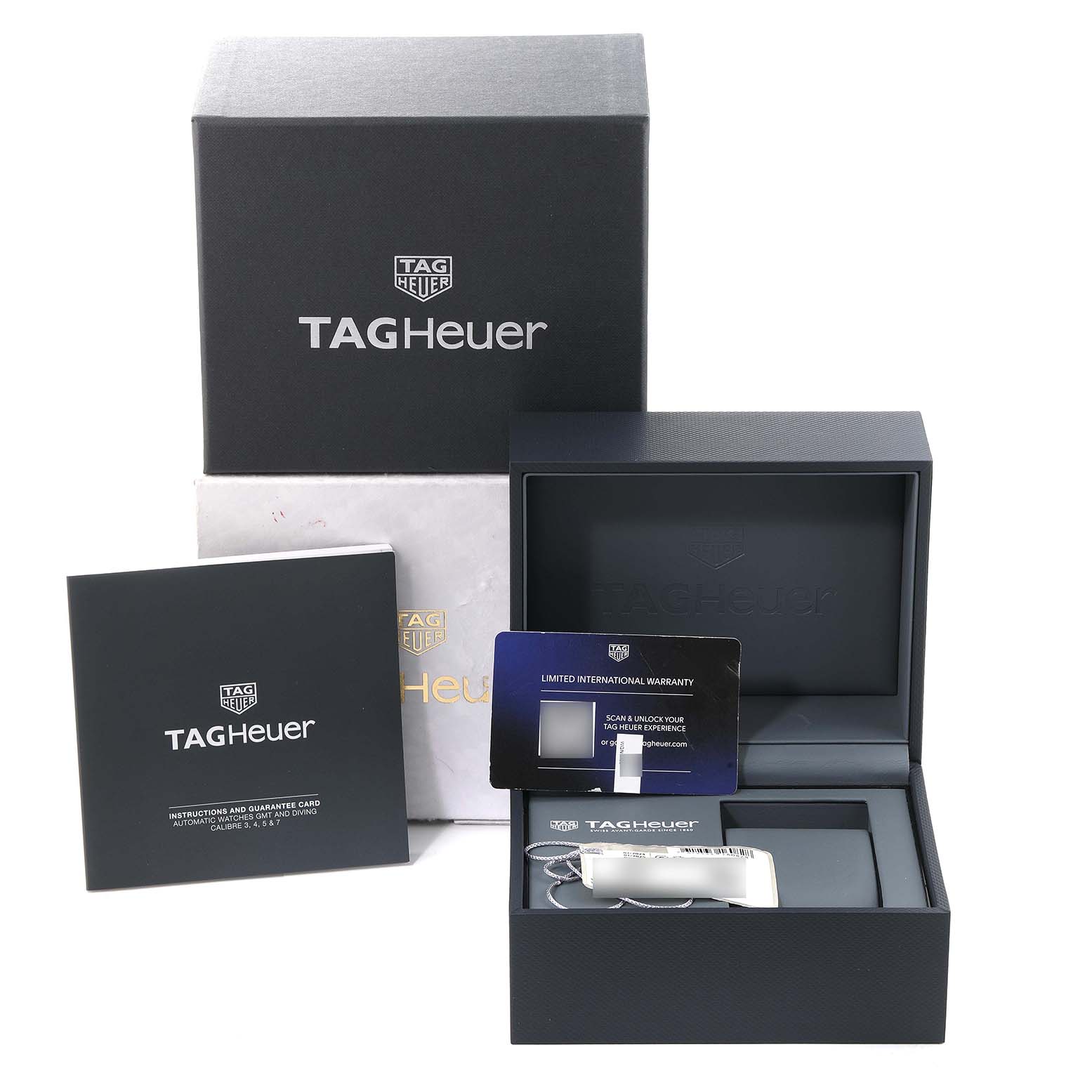 The image shows the packaging and warranty card for a Tag Heuer Aquaracer WBP2151.FT6199 Men's Steel and Gold (two tone) Black Dial WBP2151.FT6199 Men's Steel and Gold (two tone) Black Dial watch, including its box and manual.