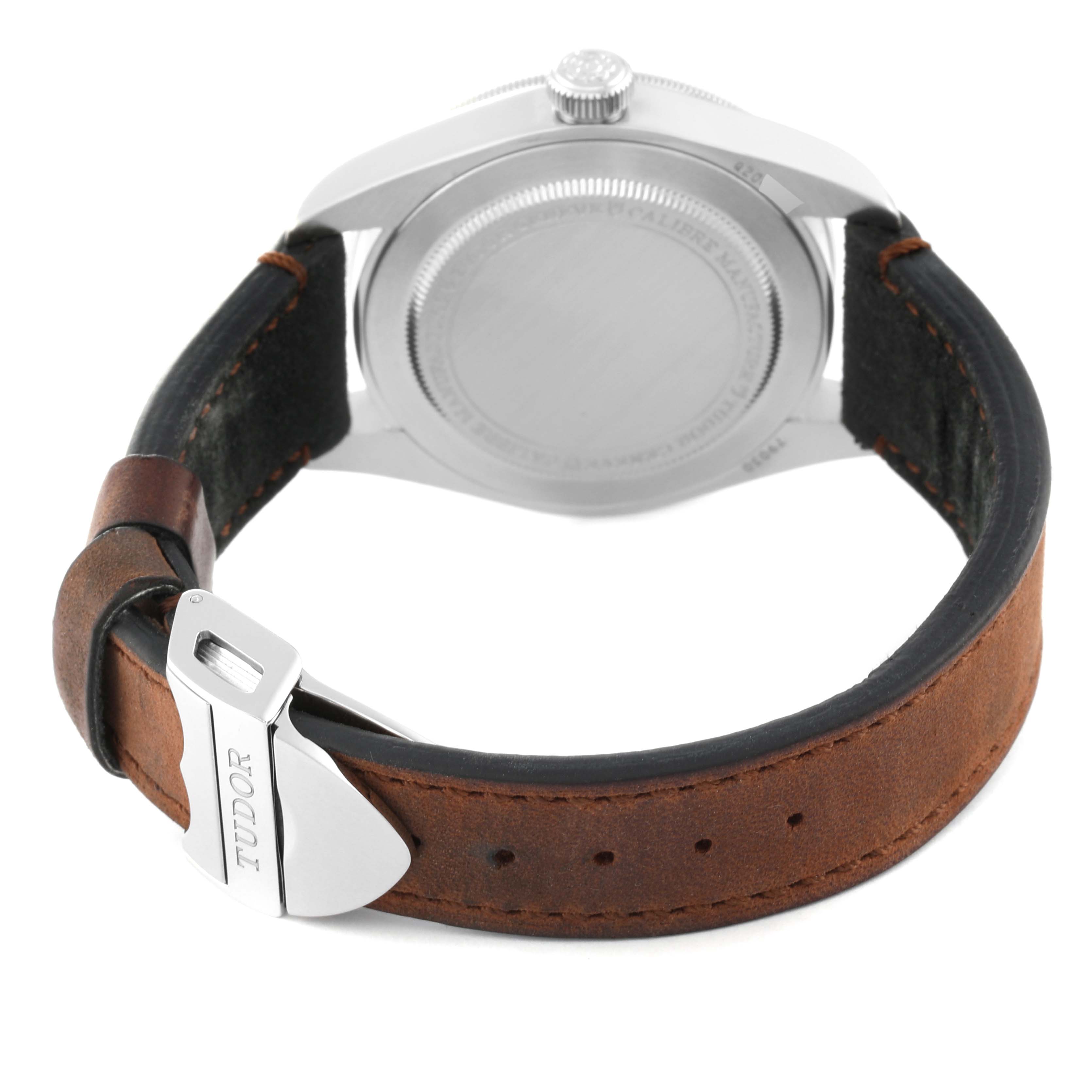 This image shows the back and clasp of a Tudor Heritage Black Bay M79030N-0001 Men
s Stainless Steel Black Dial M79030N-0001 Men
s Stainless Steel Black Dial watch with a brown leather strap.