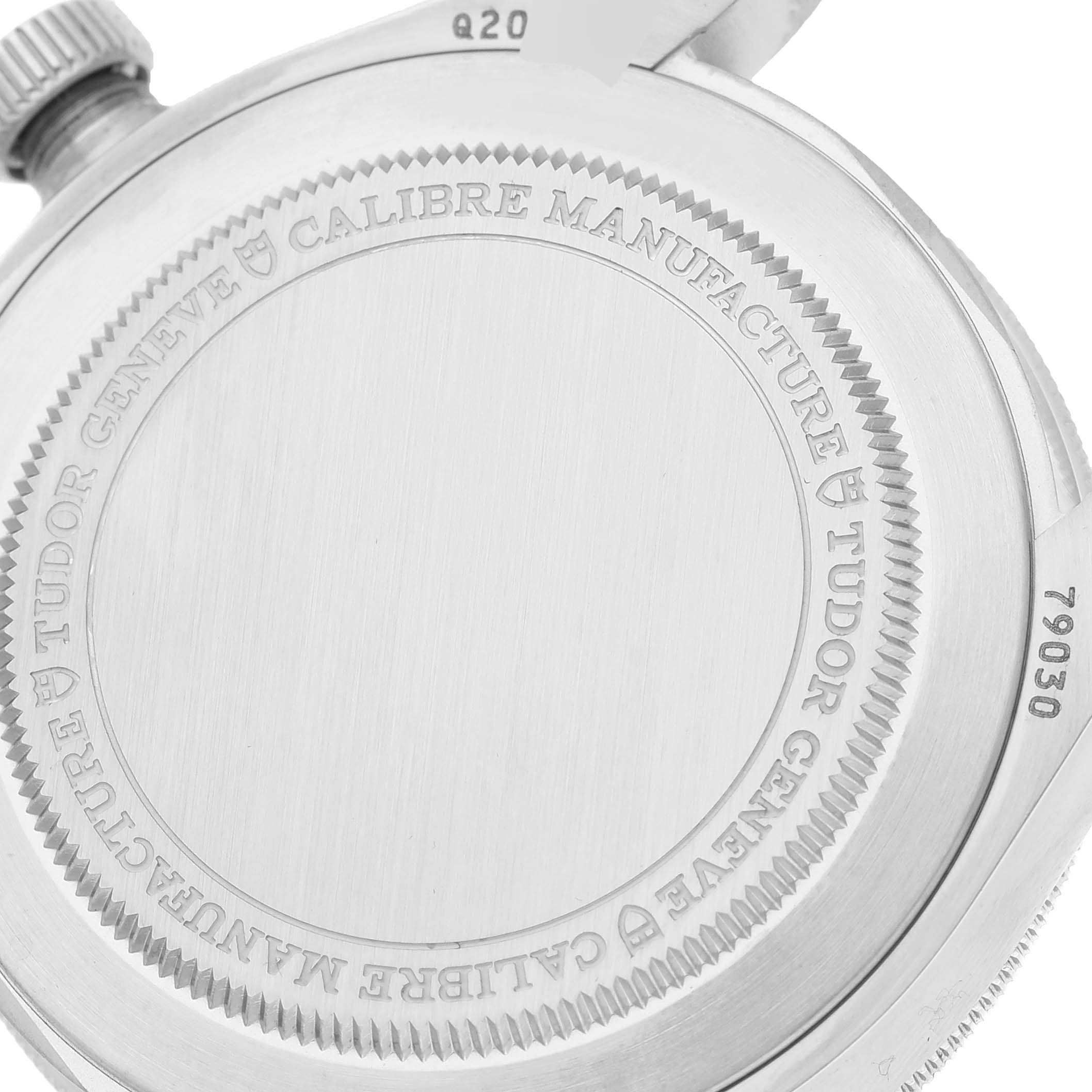 The image shows the case back of the Tudor Heritage Black Bay M79030N-0001 Men
s Stainless Steel Black Dial M79030N-0001 Men
s Stainless Steel Black Dial watch, featuring etched details and the crown partially visible.