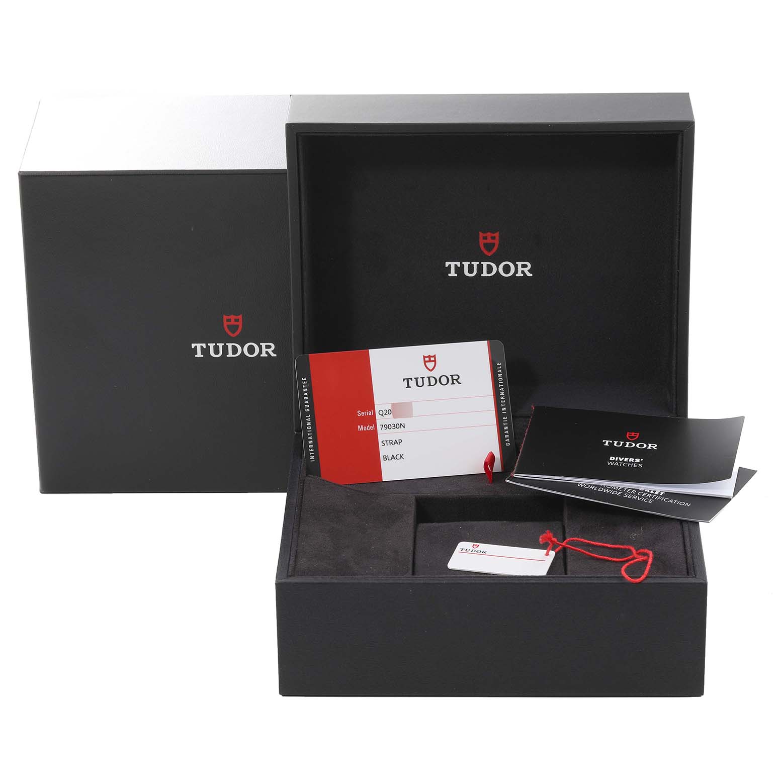 The image shows the open box and papers for a Tudor Heritage Black Bay M79030N-0001 Men
s Stainless Steel Black Dial M79030N-0001 Men
s Stainless Steel Black Dial watch from a front angle.