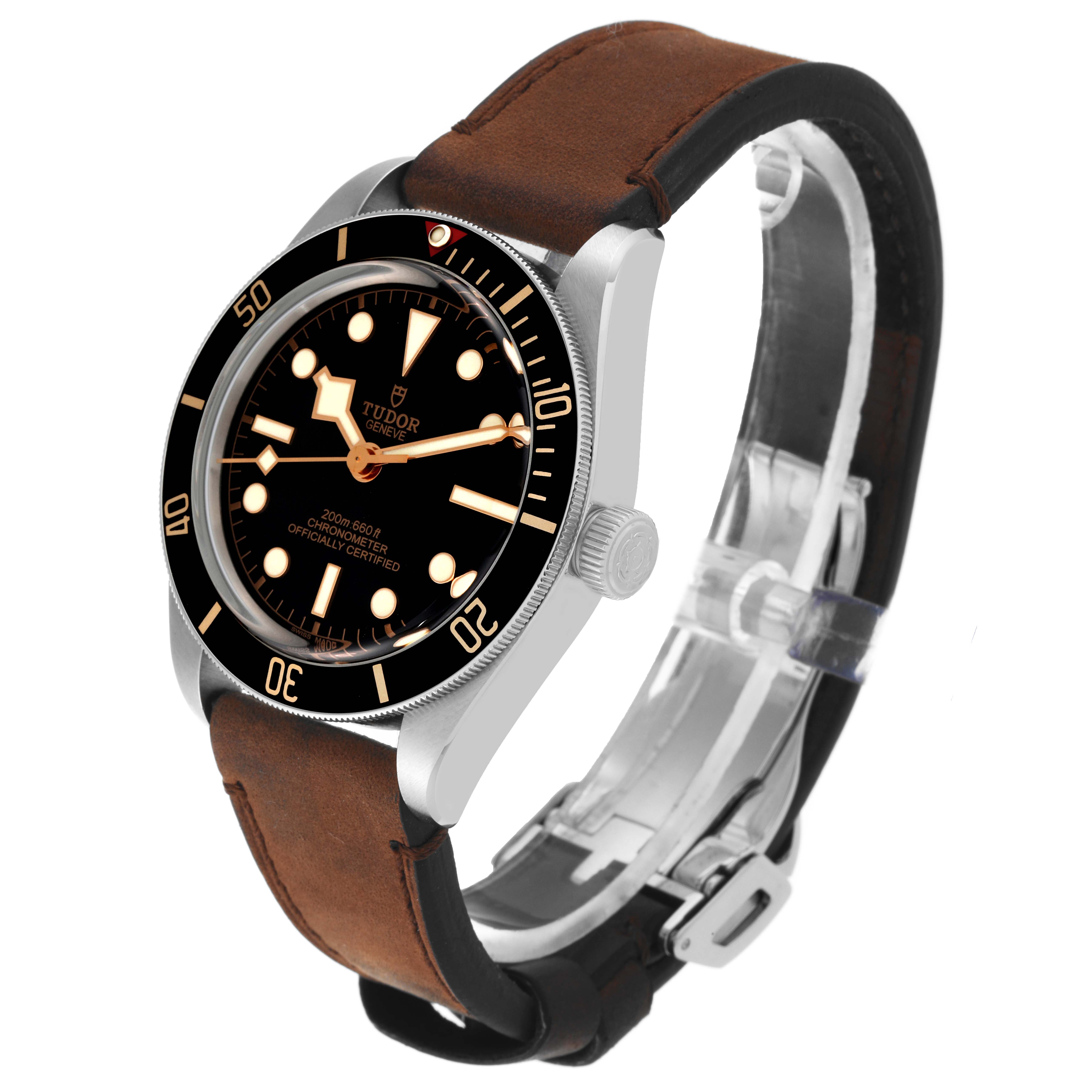 The image shows a side angle of a Tudor Heritage Black Bay M79030N-0001 Men
s Stainless Steel Black Dial M79030N-0001 Men
s Stainless Steel Black Dial watch, highlighting its dial, case, and leather strap.