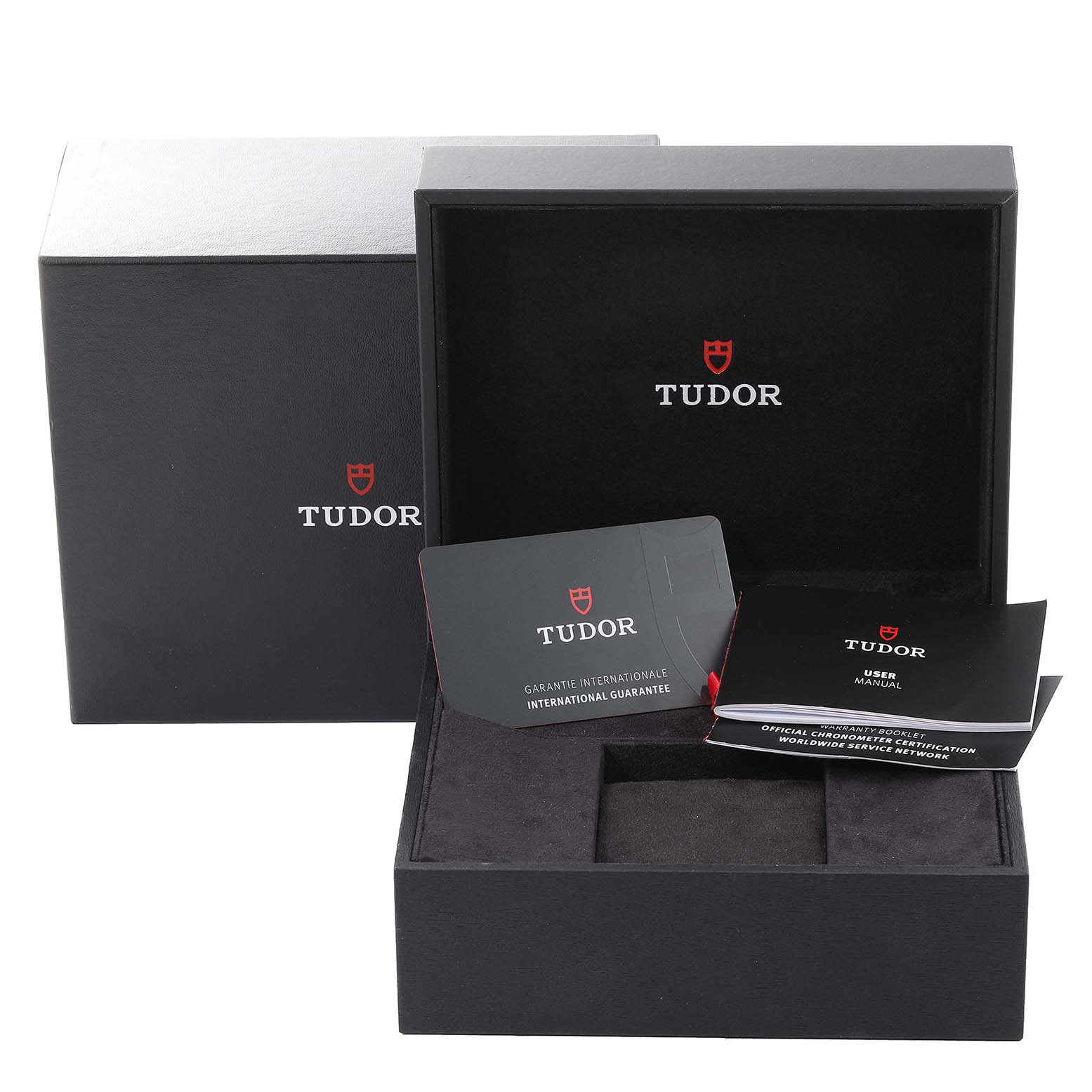 This image shows the Tudor Heritage Black Bay 79030B Men's Stainless Steel Blue Dial 79030B Men's Stainless Steel Blue Dial watch box, international guarantee card, and user manual from a front angle.