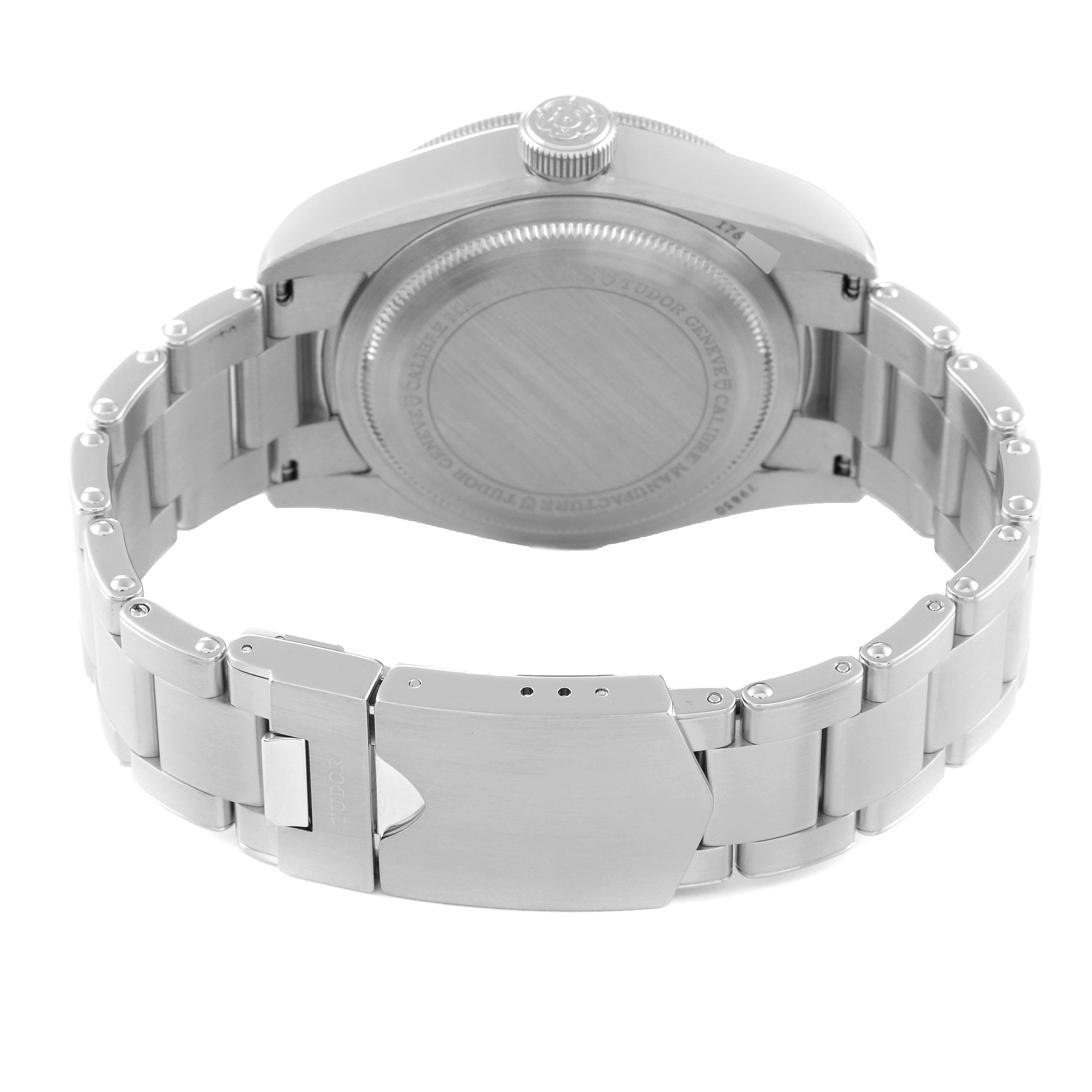 The image shows the back view of the Tudor Heritage Black Bay 79830RB Men
s Stainless Steel Black Dial 79830RB Men
s Stainless Steel Black Dial watch, focusing on the case back, crown, and bracelet clasp.