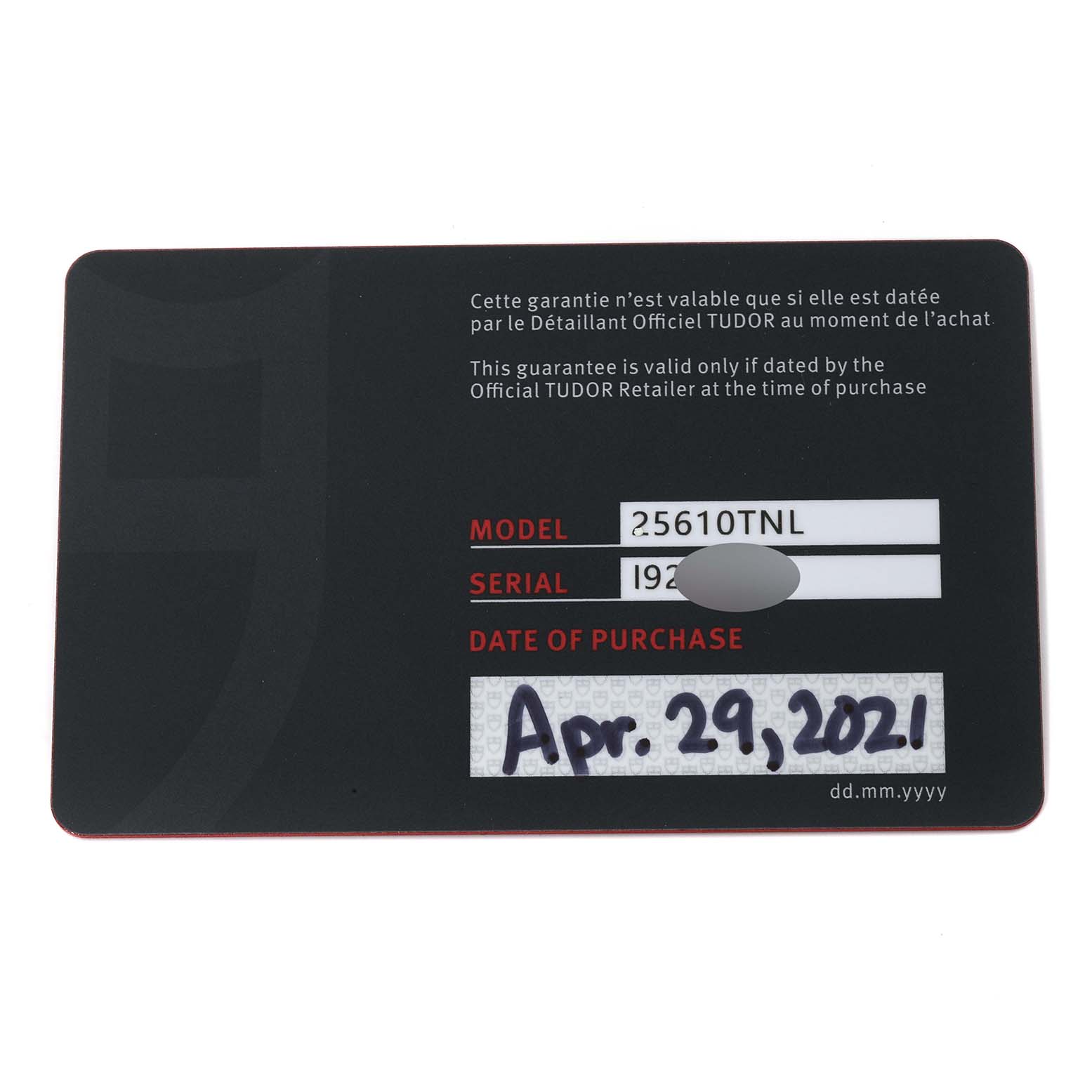 This is the warranty card for the Tudor Pelagos 25610TNL Men
s Titanium Black Dial 25610TNL Men
s Titanium Black Dial model, showing the model number, serial number (partially obscured), and date of purchase.