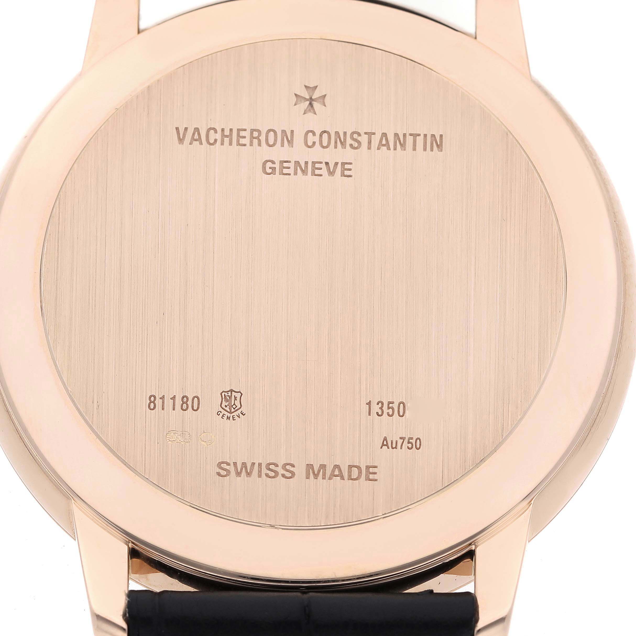 The image shows the case back of a Vacheron Constantin Patrimony 81180 Men's Rose Gold Grey Dial 81180 Men's Rose Gold Grey Dial watch, displaying engravings and serial numbers.