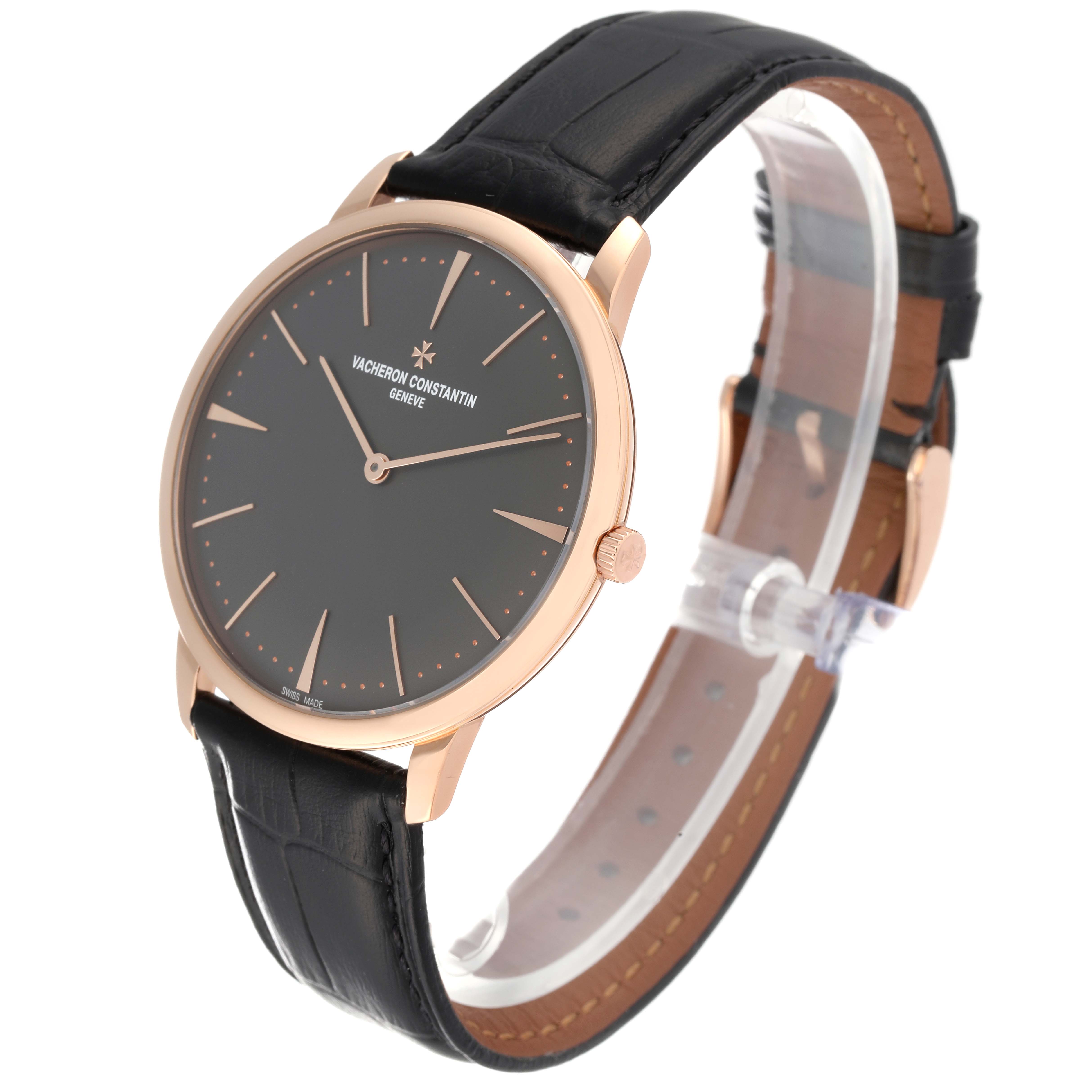 The Patrimony model by Vacheron Constantin is shown at a three-quarter angle, highlighting the dial, bezel, crown, and strap.