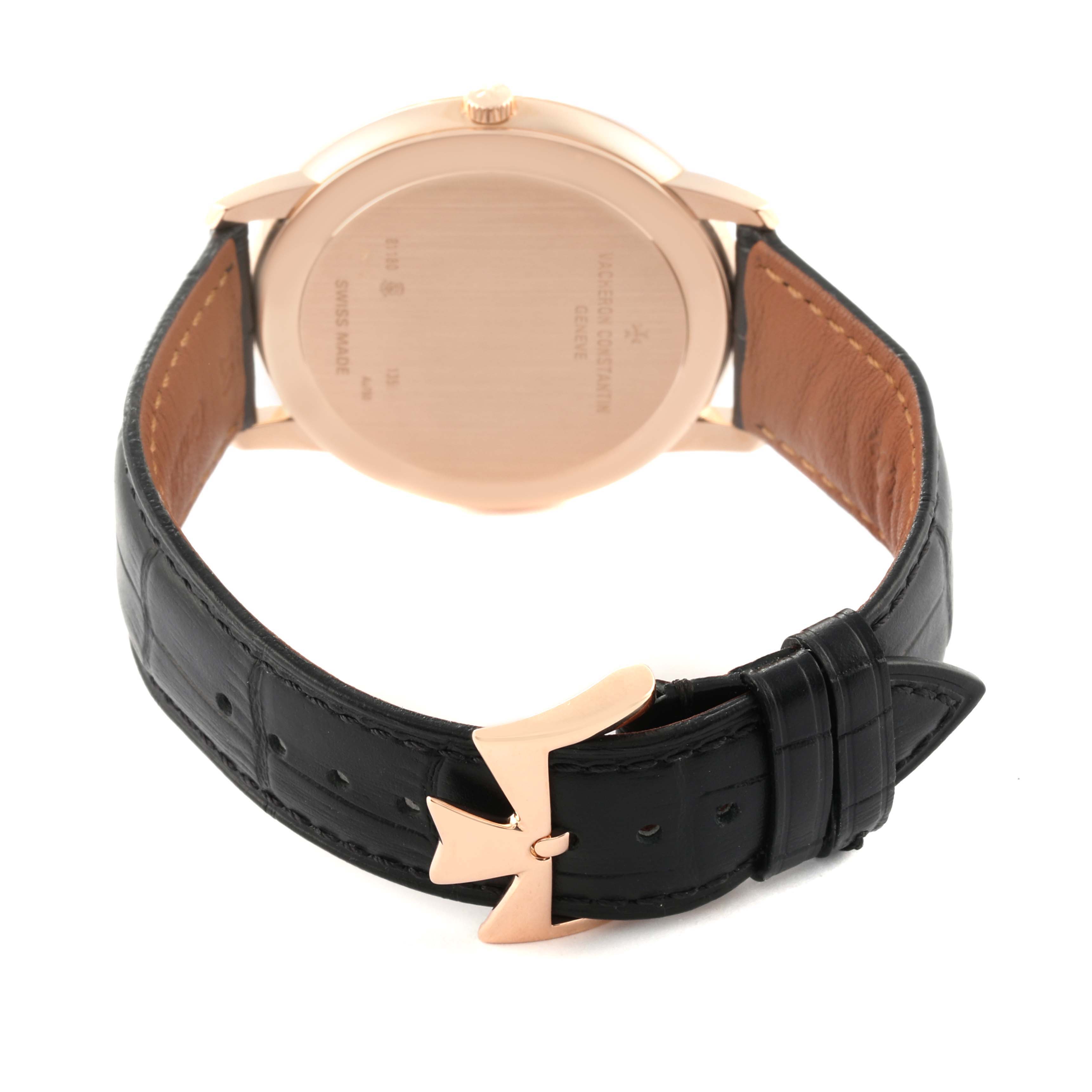 The image shows the back and clasp of a Vacheron Constantin Patrimony 81180 Men's Rose Gold Grey Dial 81180 Men's Rose Gold Grey Dial watch, highlighting the case back and black leather strap with a rose gold buckle.
