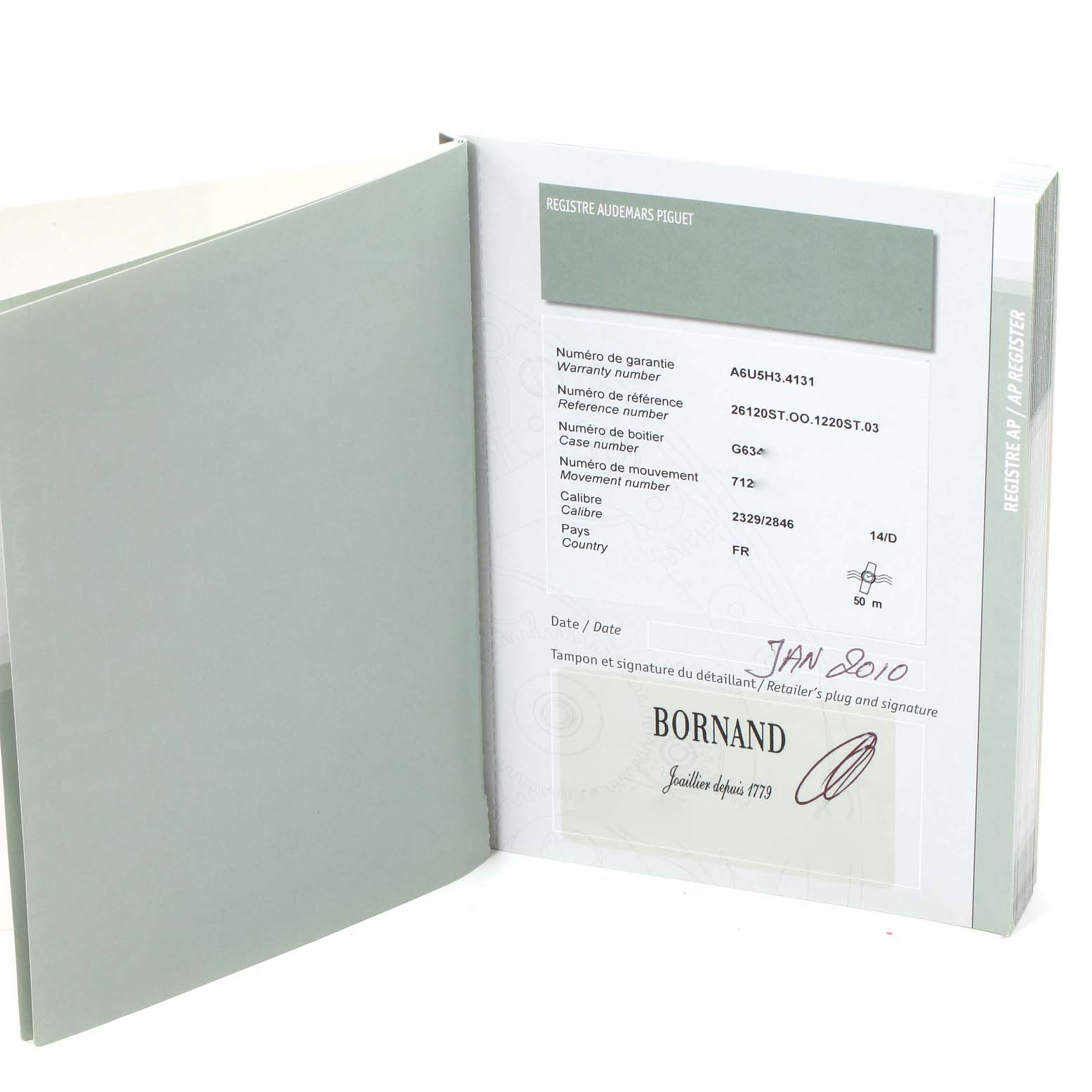 The image shows an open warranty booklet for an Audemars Piguet Royal Oak 26120ST.00.1220ST.03 Men's Stainless Steel Black Dial 26120ST.00.1220ST.03 Men's Stainless Steel Black Dial watch, displaying warranty and reference details.