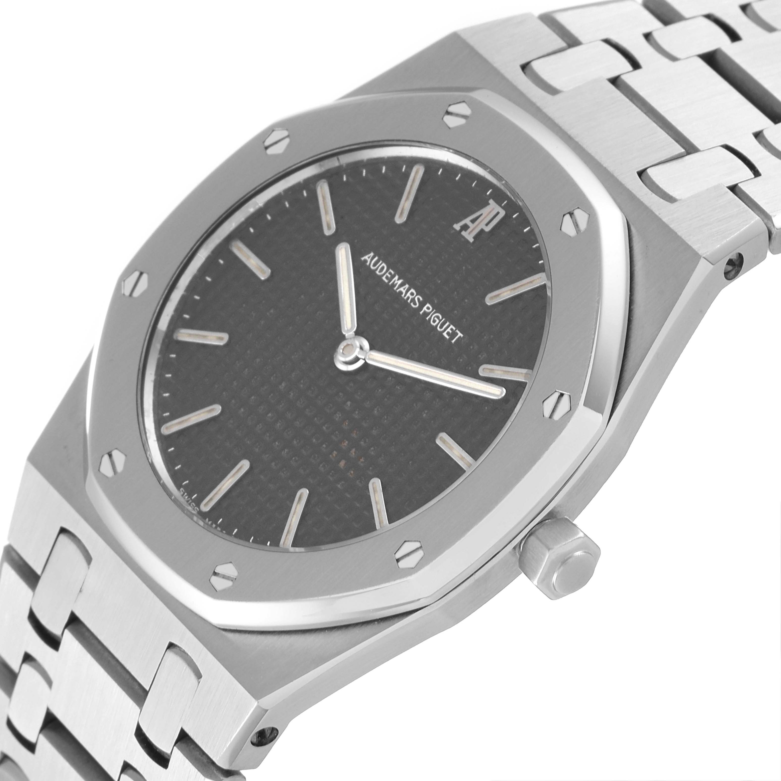 The image shows an angled view of the dial, bezel, crown, and part of the bracelet of the Royal Oak watch by Audemars Piguet.