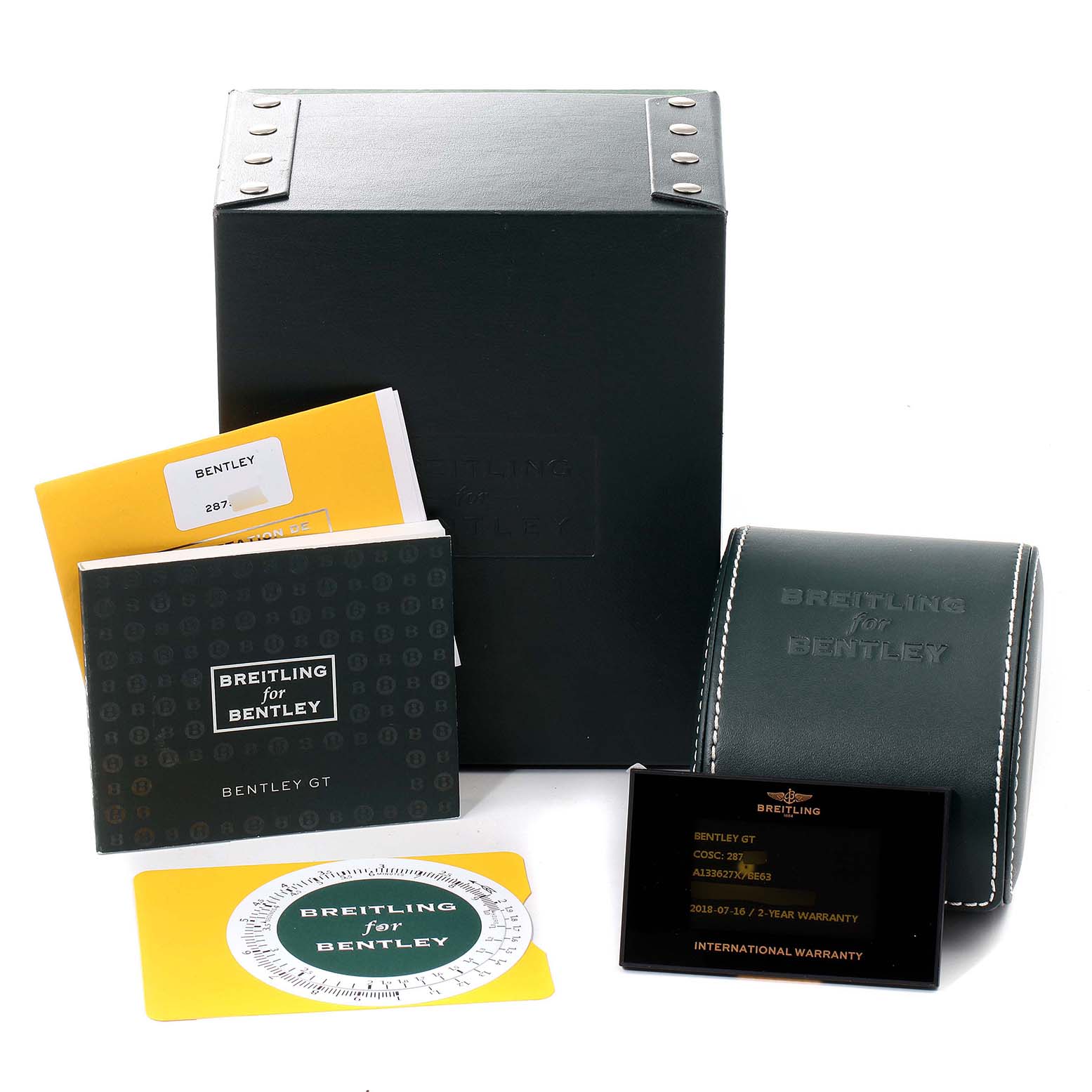 The image shows accessories for a Bentley model by Breitling including manuals, a warranty card, and packaging.