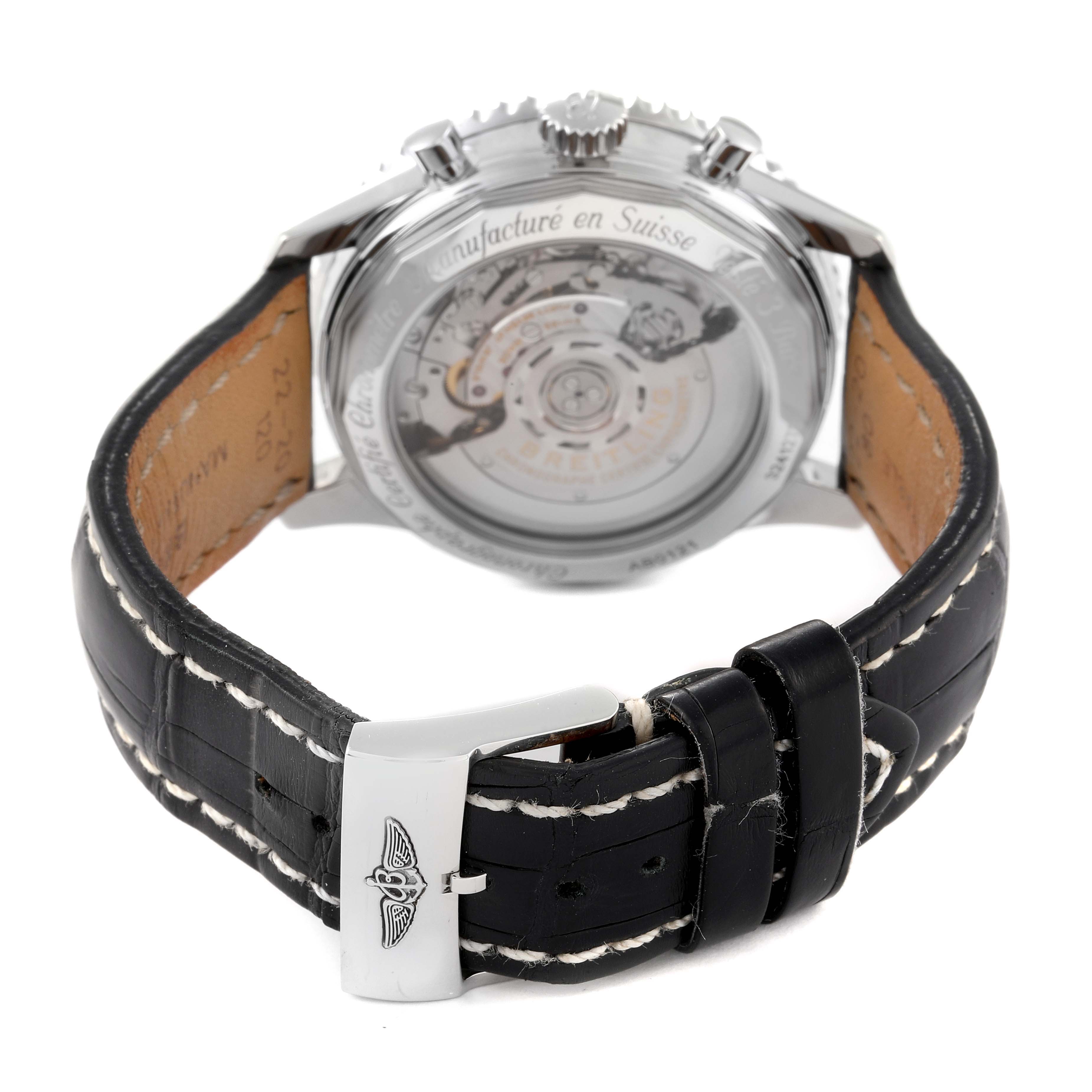 The image shows the back of a Breitling Navitimer AB0121 Men's Stainless Steel Black Dial AB0121 Men's Stainless Steel Black Dial watch, focusing on the transparent case back and leather strap with a clasp.