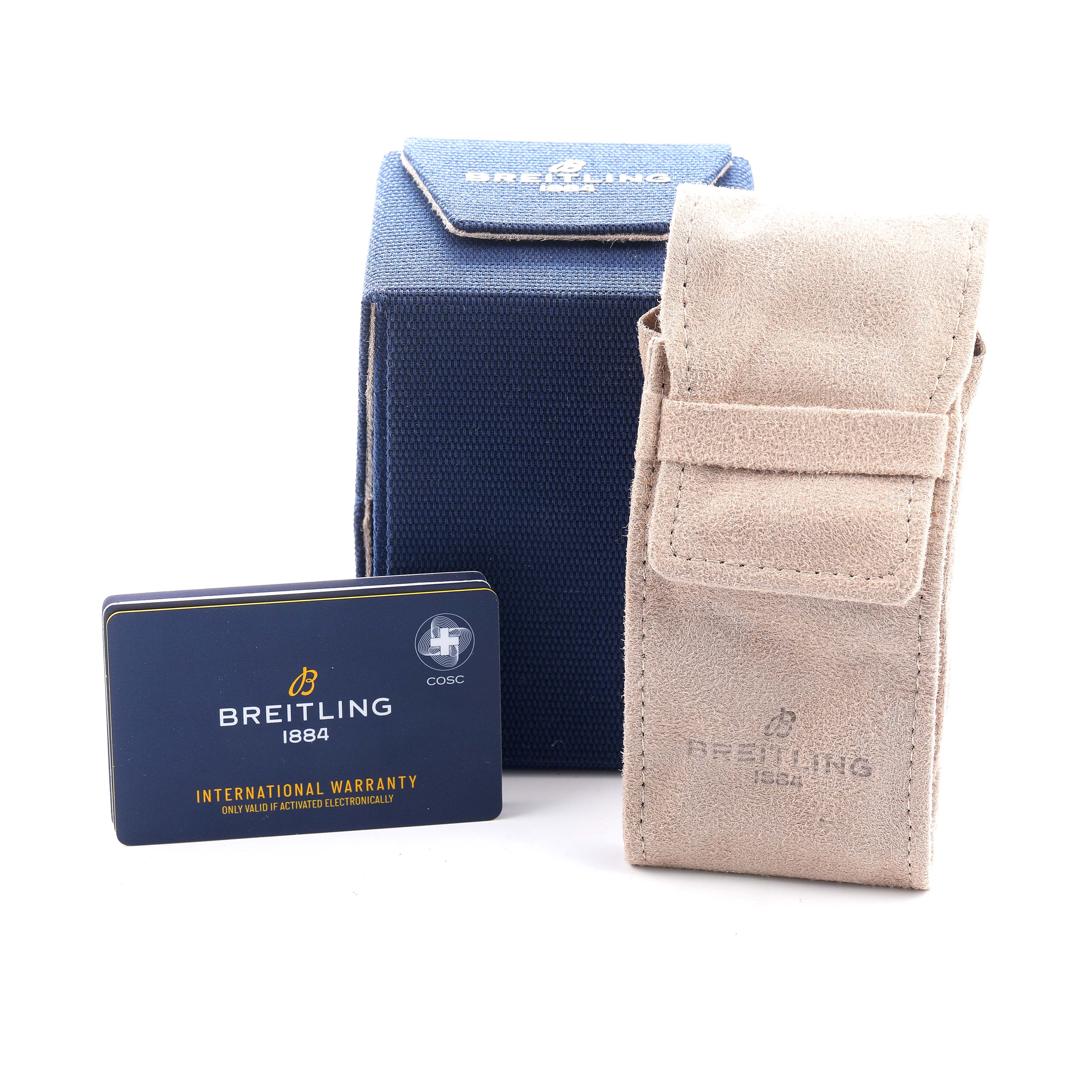 The image shows Breitling Navitimer AB0137 Men's Stainless Steel Blue Dial accessories, including a warranty card, a blue box, and a beige pouch.